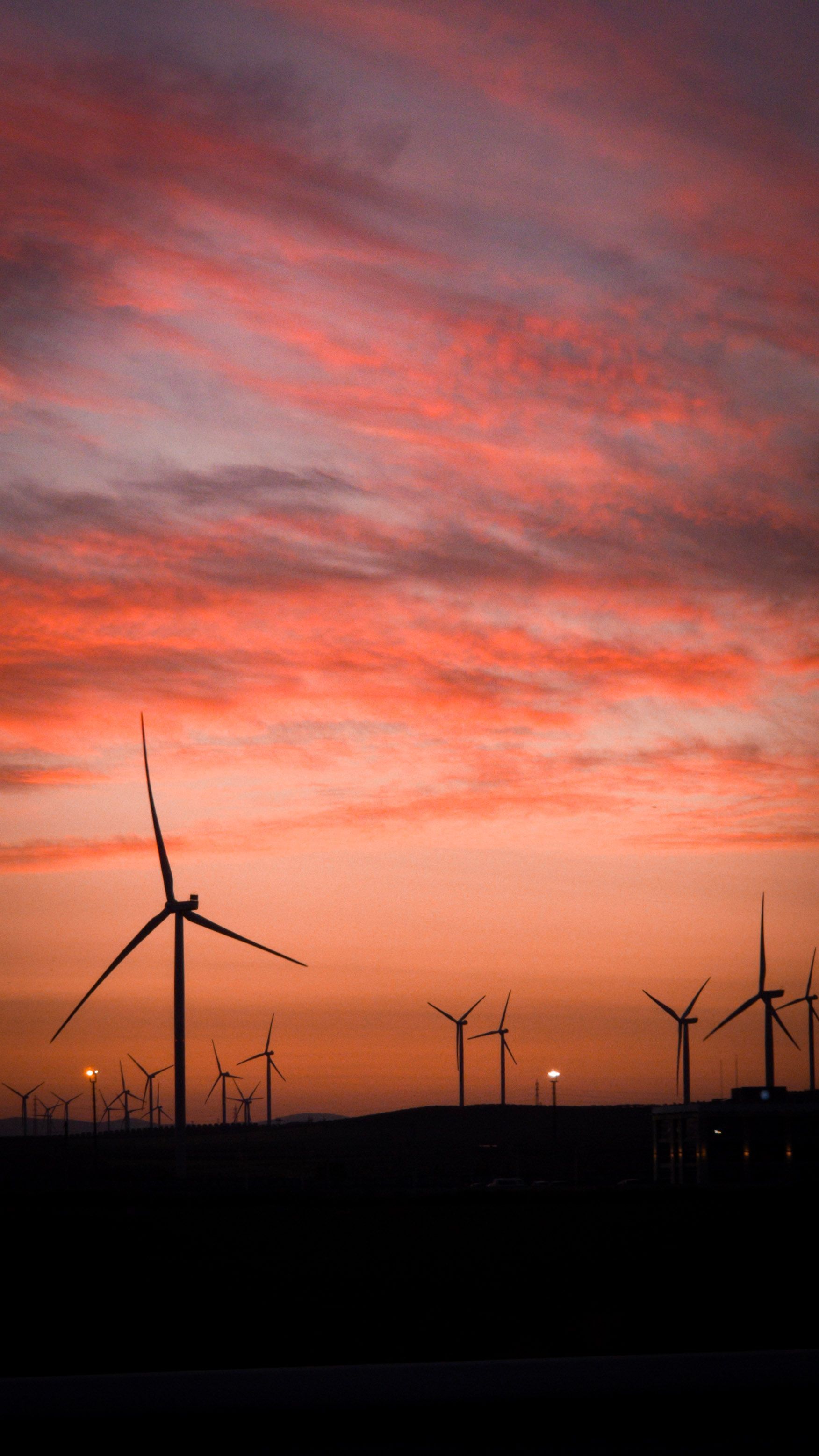 1752x3116 Majestic Wind Turbines at Sunset Silhouette · Free