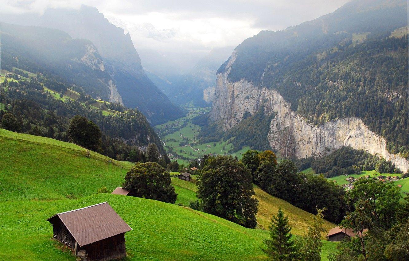 1332x850 Wallpaper trees, mountains, rocks, Switzerland, valley, slope, village, panorama, haze, houses, gorge, Lauterbrunnen image for desktop, section пейзажи