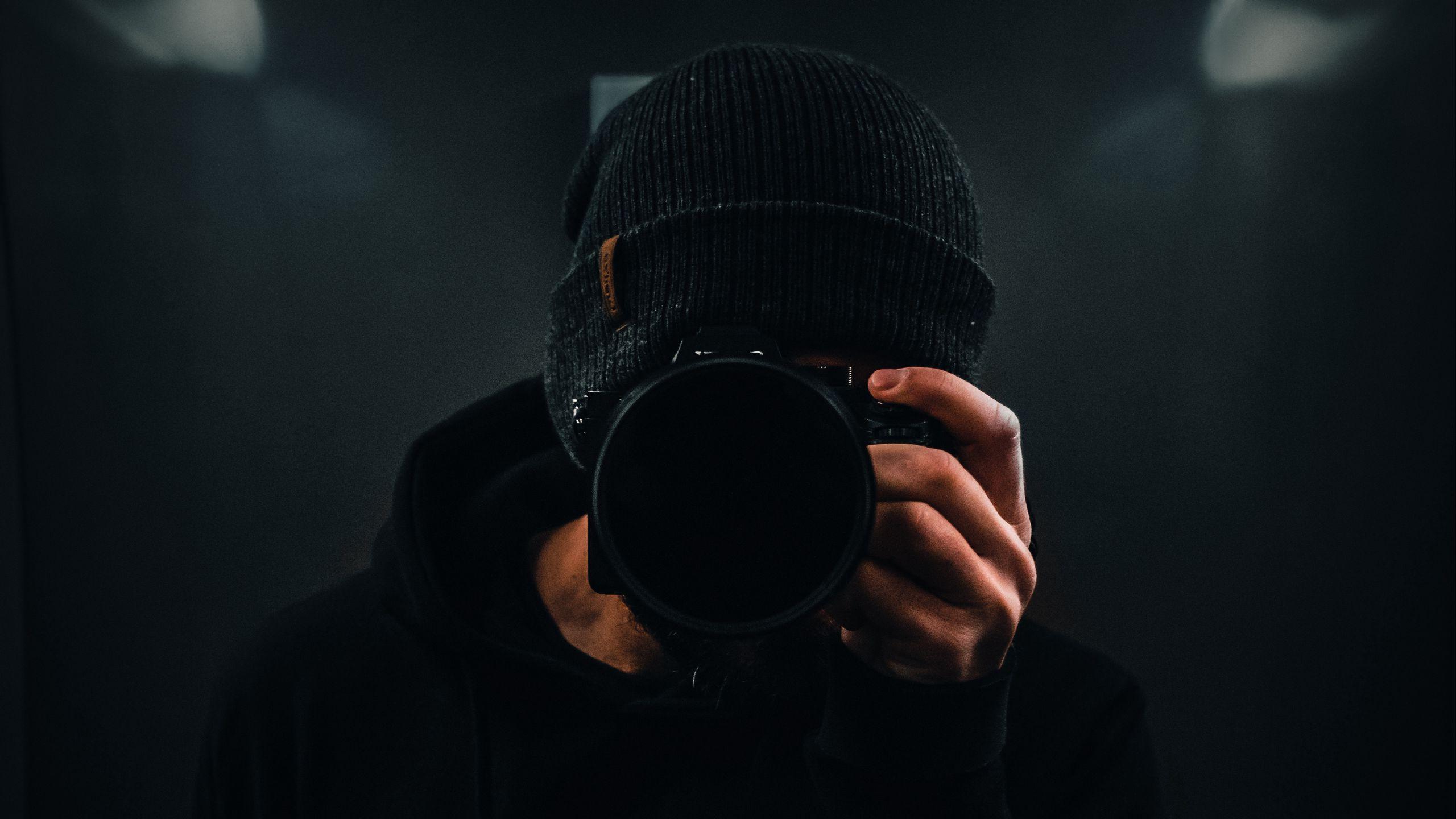 2560x1440 Download wallpaper 2560x1440 photographer, camera, dark, black widescreen 16:9 HD background