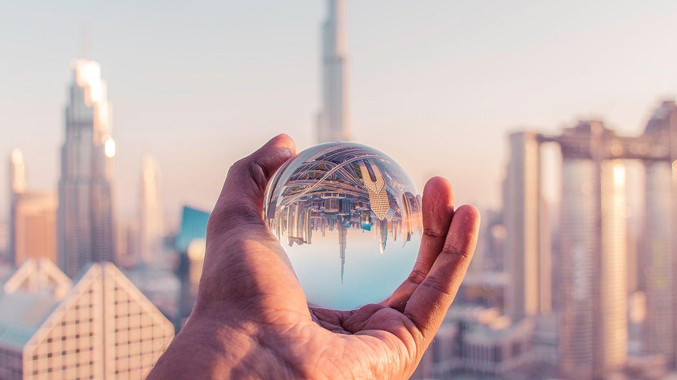 1366x768 Dubai Tower Ball Hand Nature Wallpaper