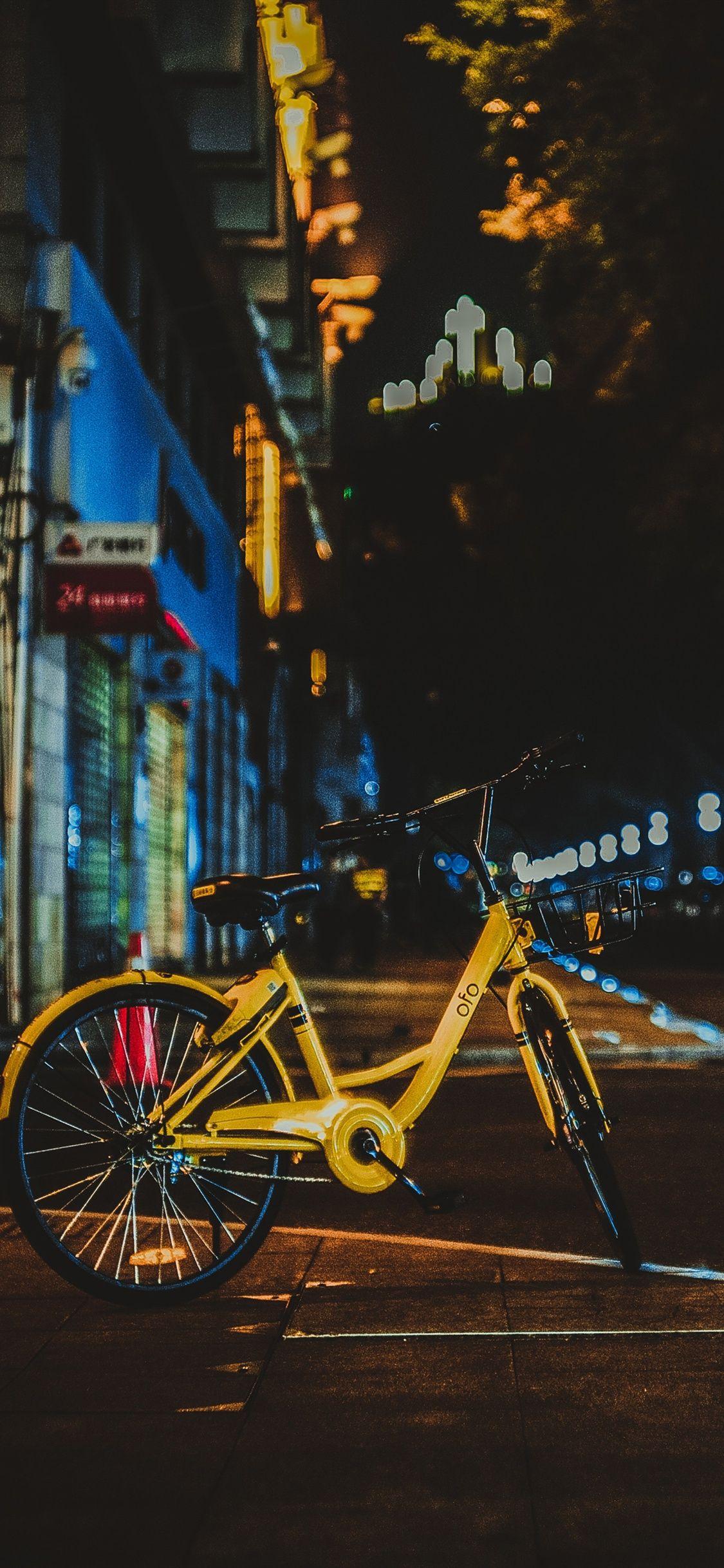 1125x2436 Yellow bicycle, city night iPhone X 3GS wallpaper