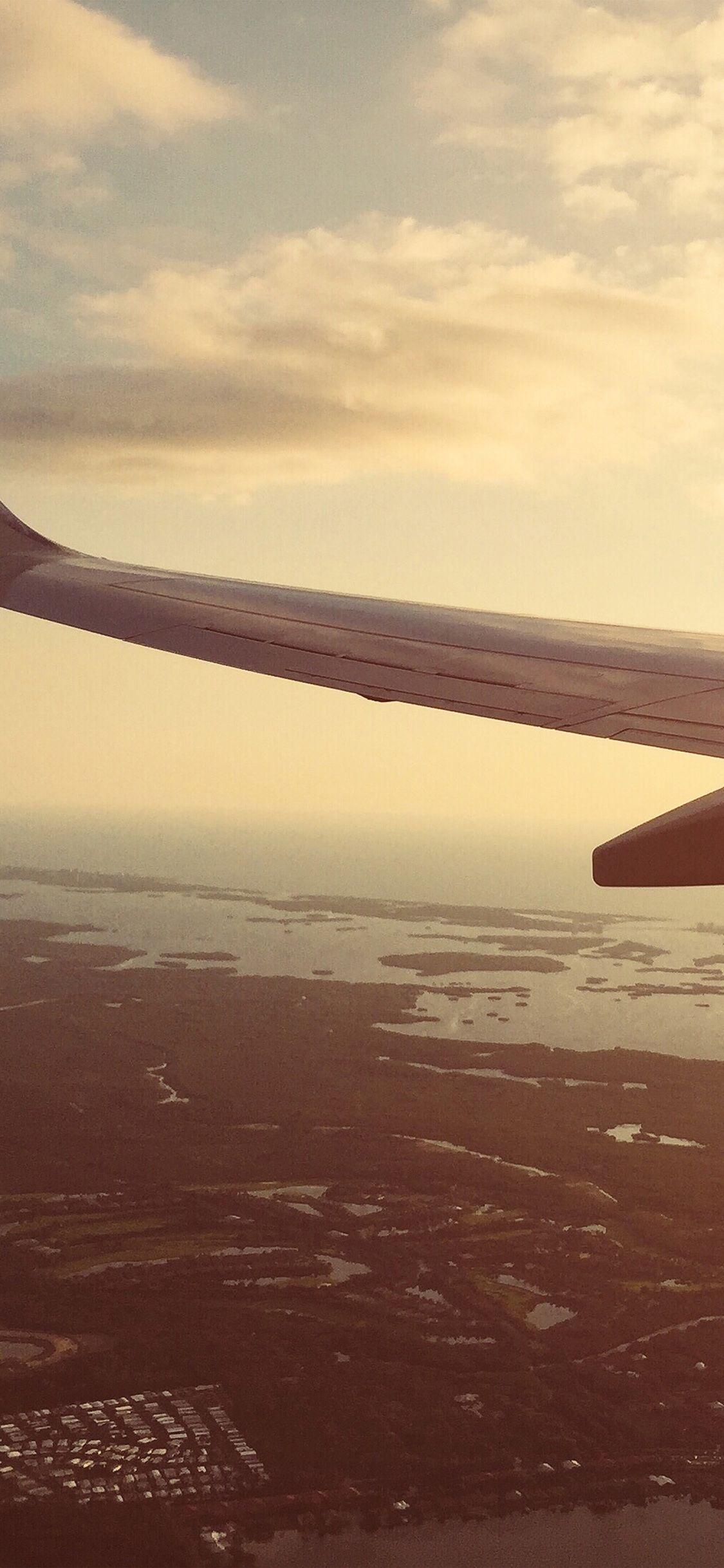 1125x2436 iPhone wallpaper. fly airplane sky sunset city