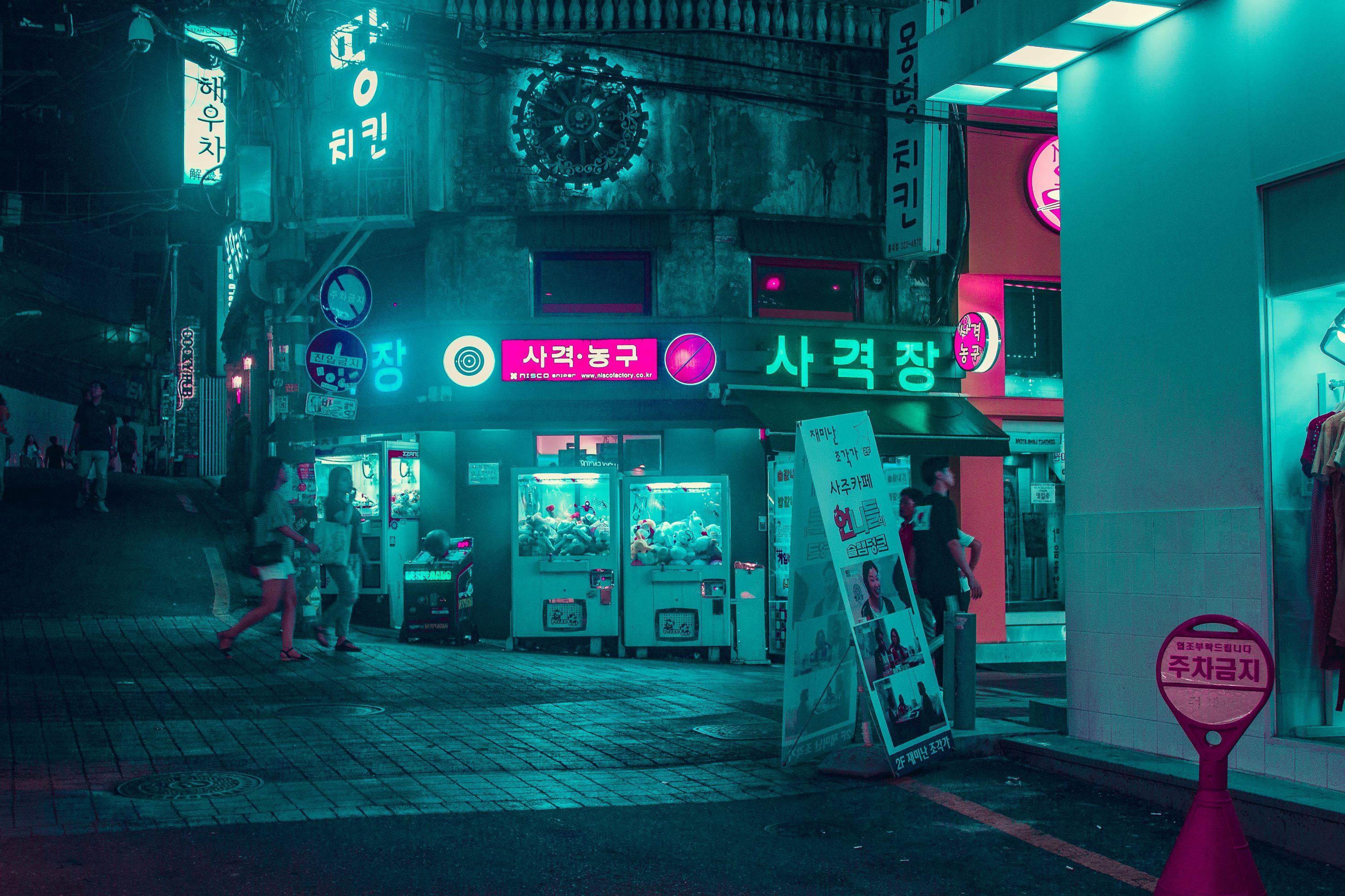 3000x2000 Group of people walking on the street near buildings at night time photo