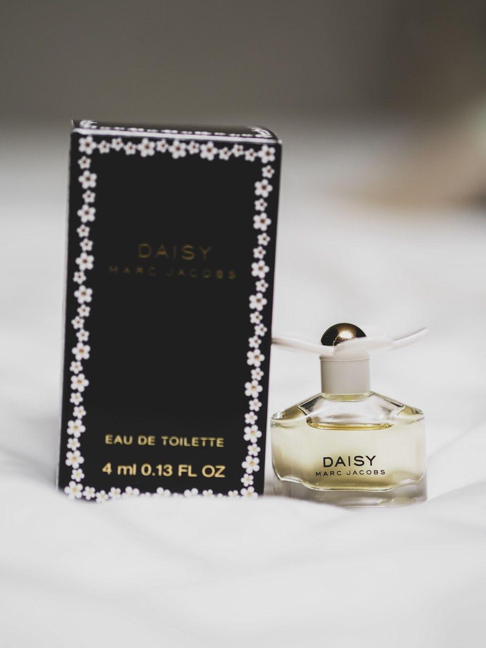 1000x1333 black and gold perfume bottle photo