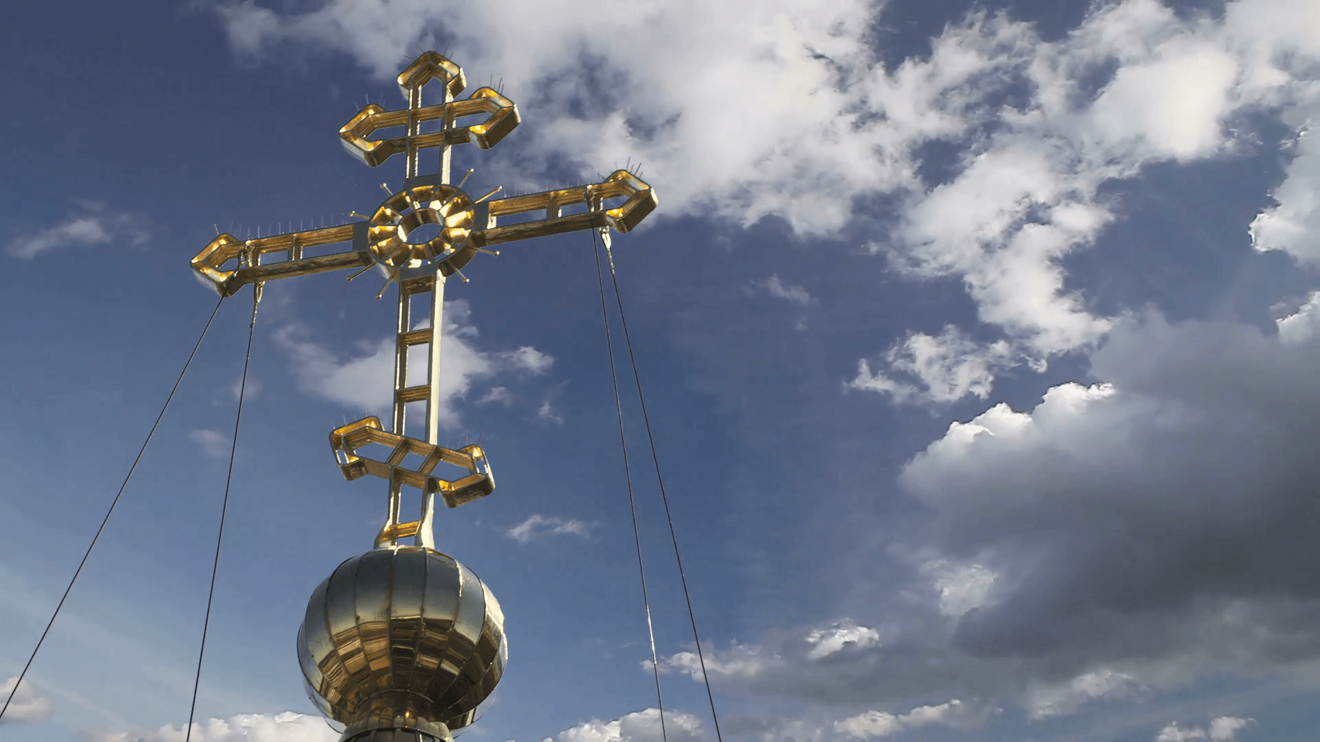 1920x1080 Orthodox church cross on blue cloudy sky background. Russian church