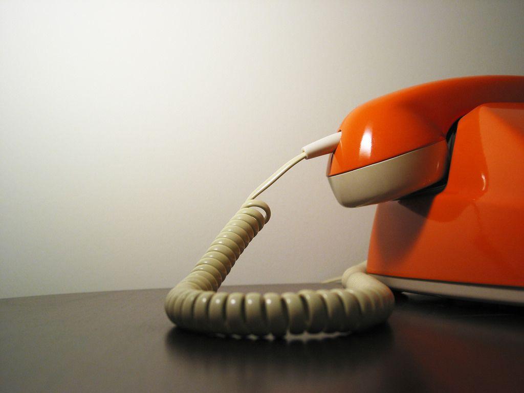 1024x768 Hotline. Vintage telephone (orange, of course) in the Veer