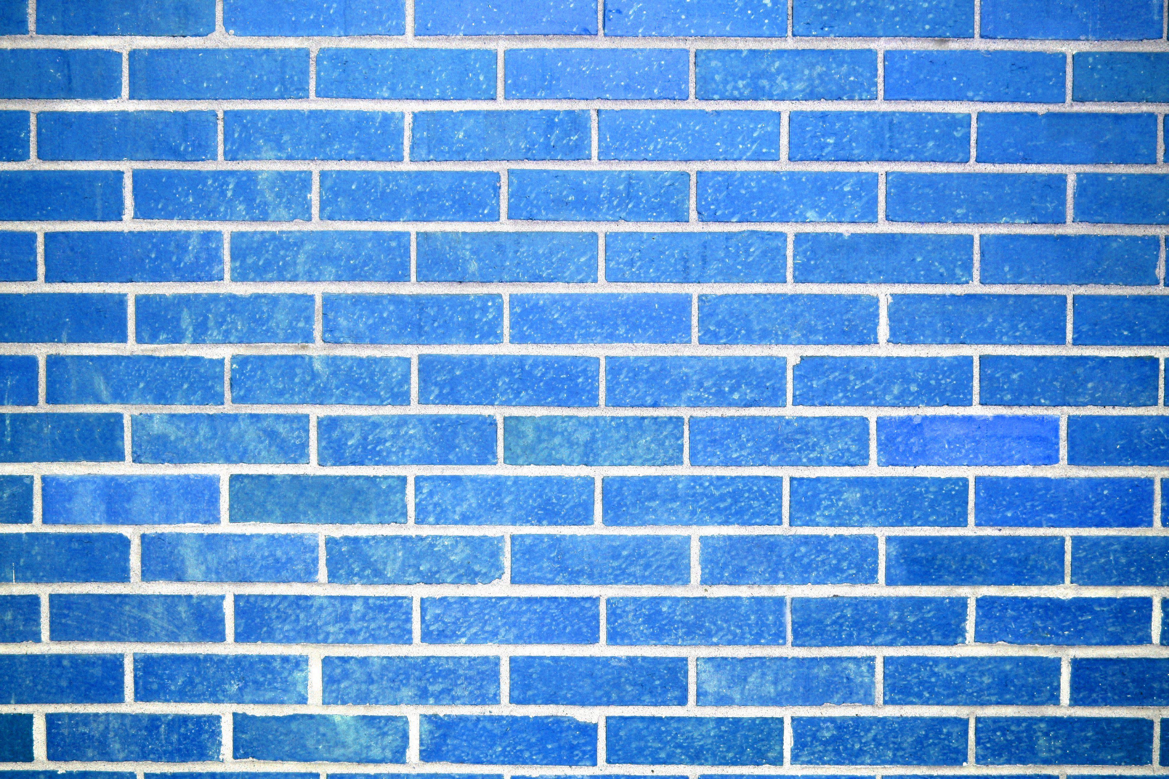 Free Vector  Spot lights on blue brick wall background