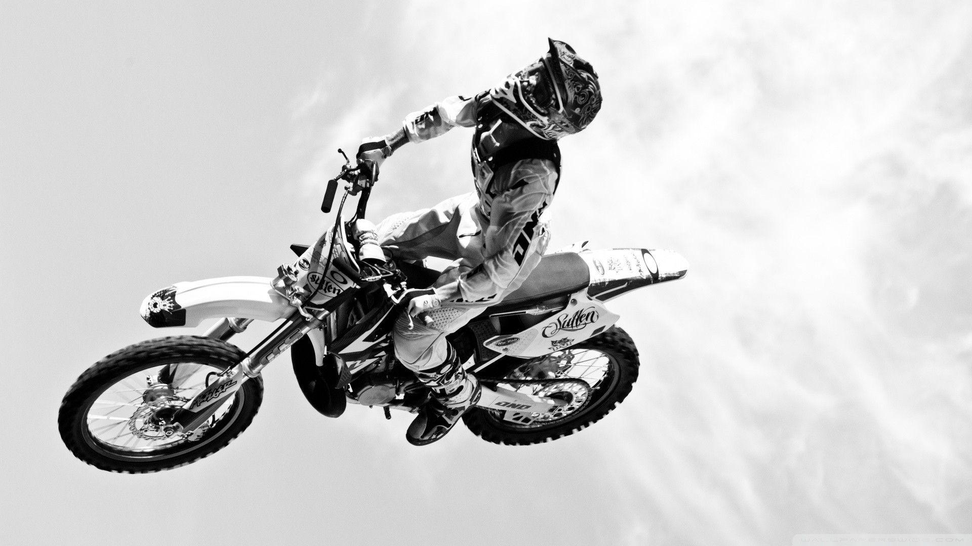 1920x1080 Dirtbike moto vehicles motorcycle motorbike bike flight fly black white wheels people uniform sky clouds extreme sports racing cross wallpaperx1080
