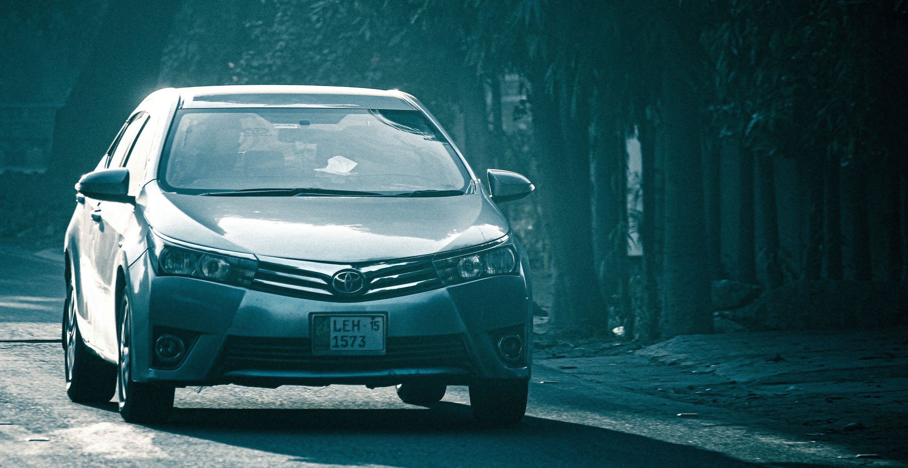 3000x1548 A white toyota car is shown outdoors. photo