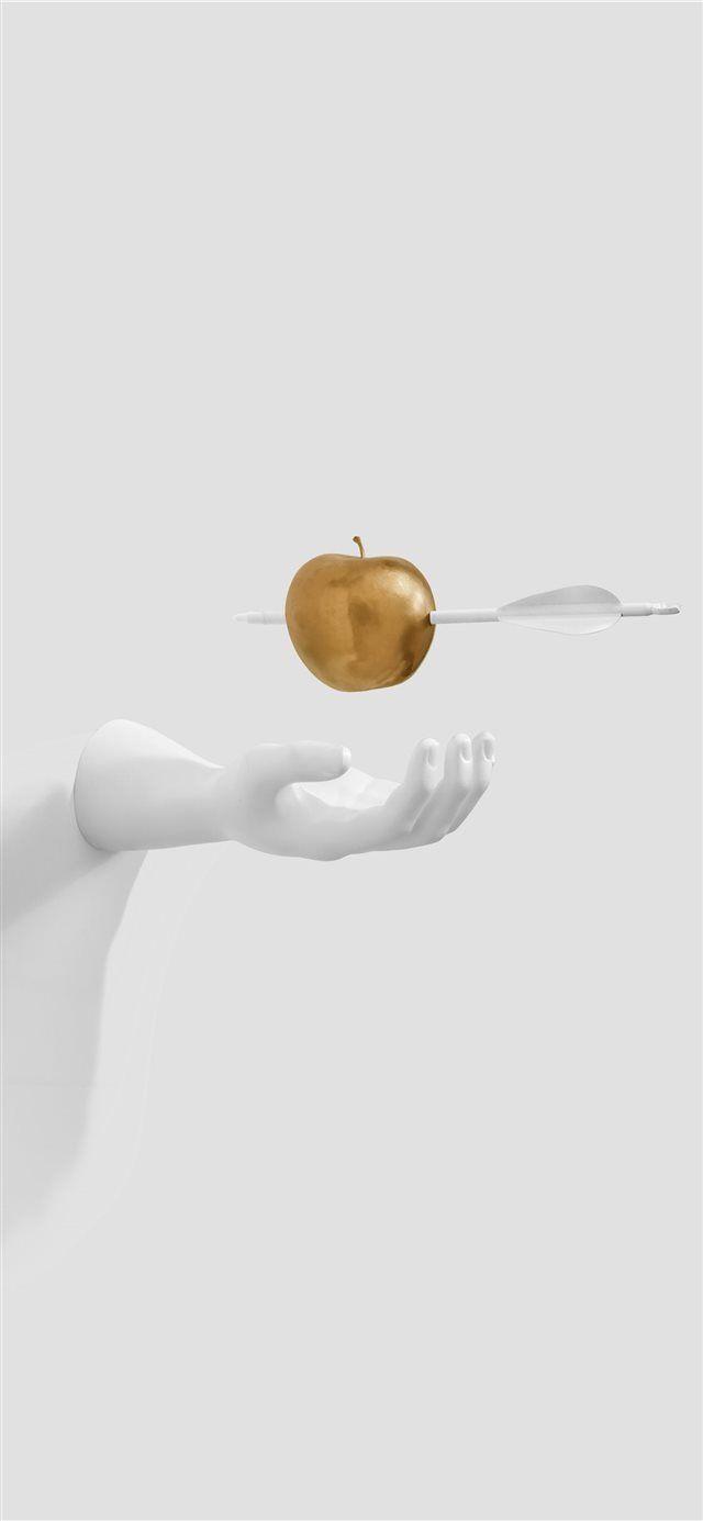 640x1385 White hand paused for golden apple iPhone X Wallpaper Free Download
