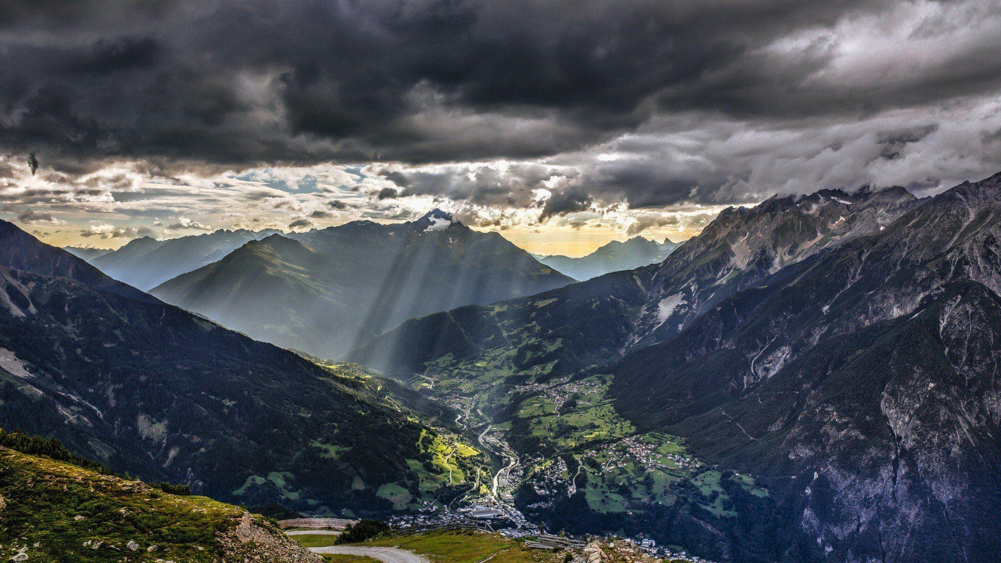 2048x1152 Torsten Haberland, Mountains, Road, Storm, Blue flowers, Dark