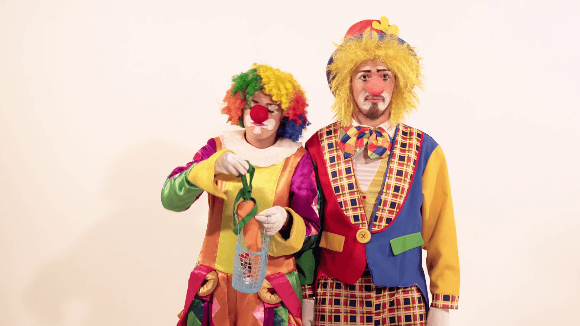 1920x1080 Funny female clown teasing the male circus clown by not giving him