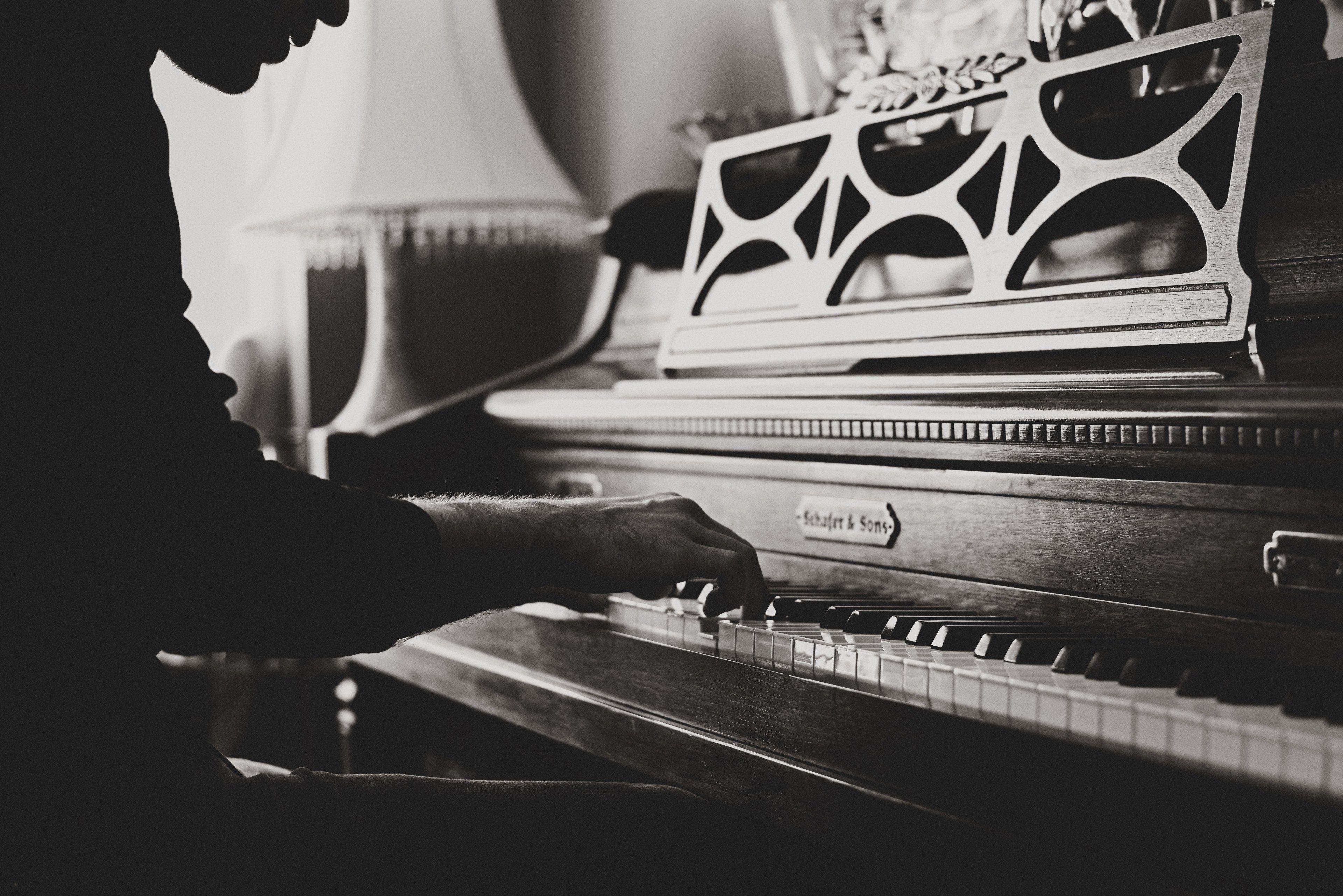 3840x2563 Wallpaper / a black and white shot of a man playing a vintage piano, vintage piano player 4k wallpaper