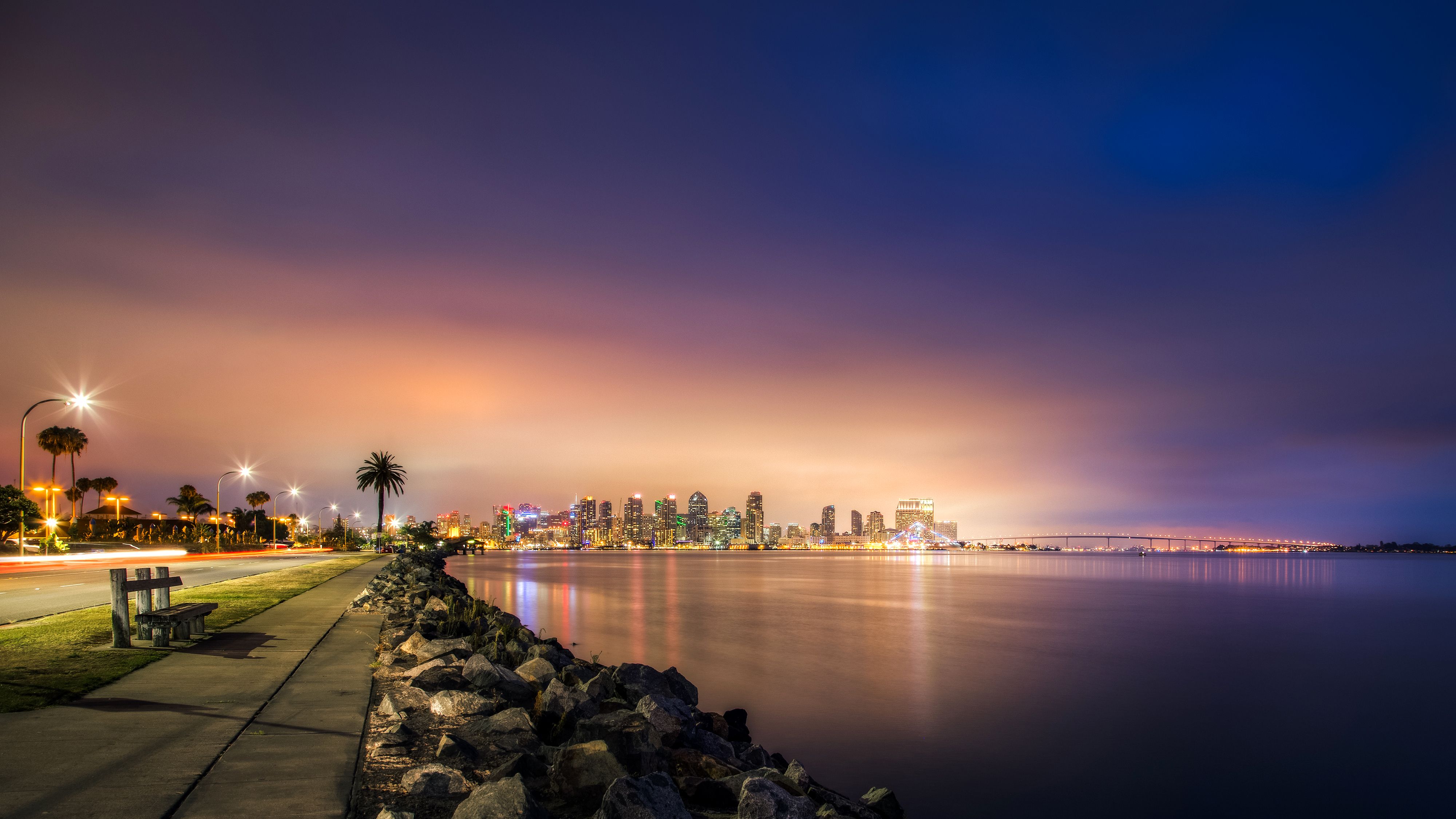 4000x2250 Wallpaper road, sea, night, bridge, lights, stones, coast, skyscrapers for mobile and desktop, section пейзажи, resolution 4000x2250