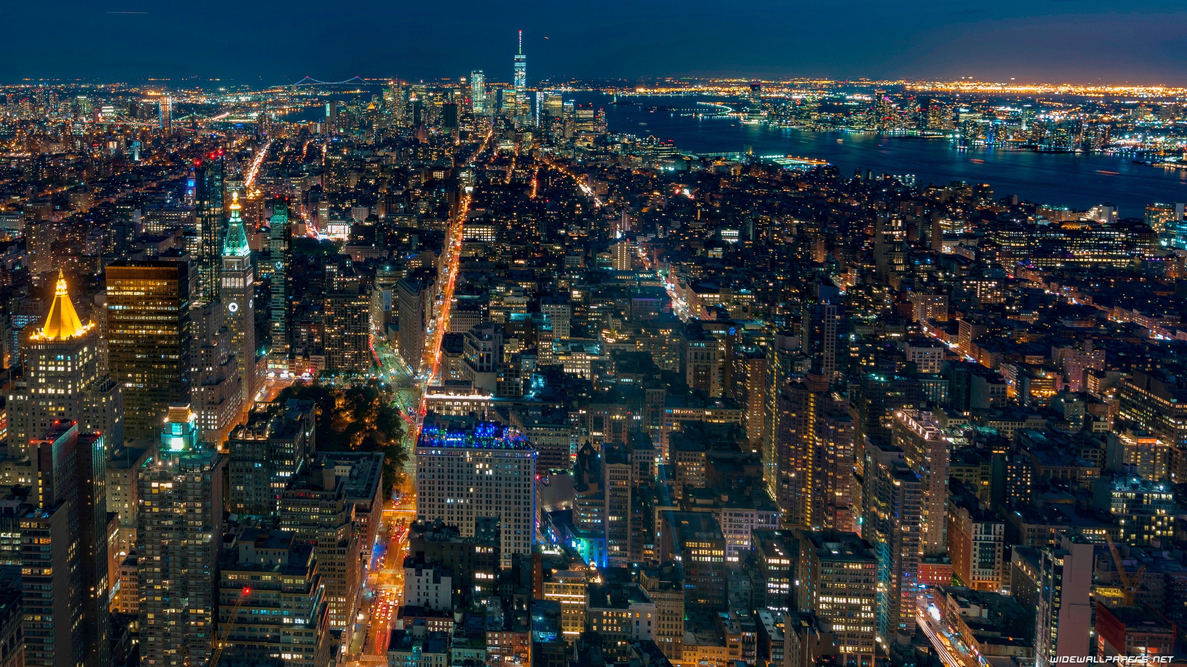 3840x2160 Aerial View Of New York City With Shimmering Lights During Nighttime 4K HD Travel Wallpaper
