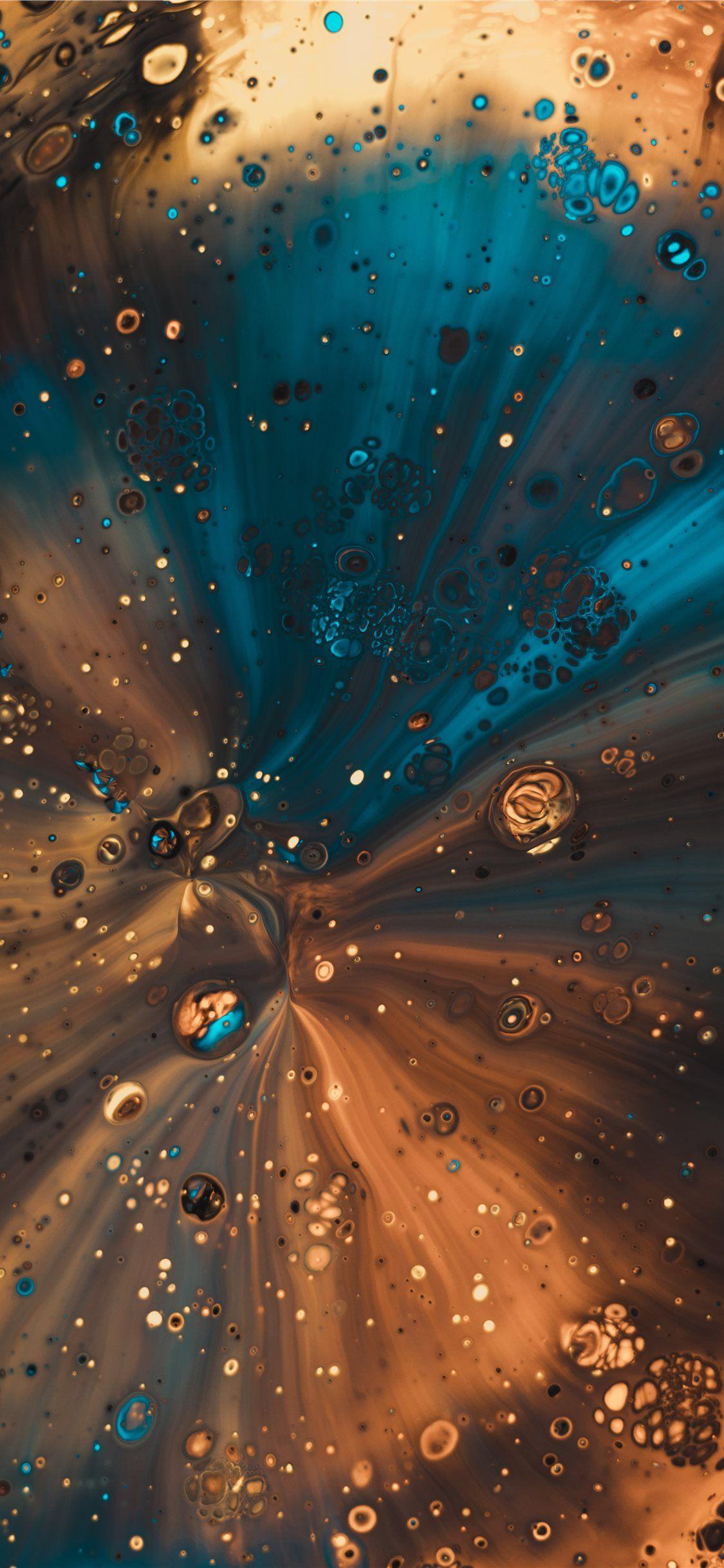 1125x2436 Some acrylic paint poured through a funnel iPhone X Wallpaper