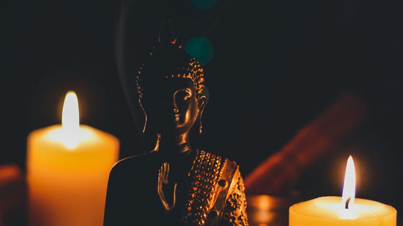 1366x768 Download wallpaper 1366x768 buddha, figurine, candles, buddhism
