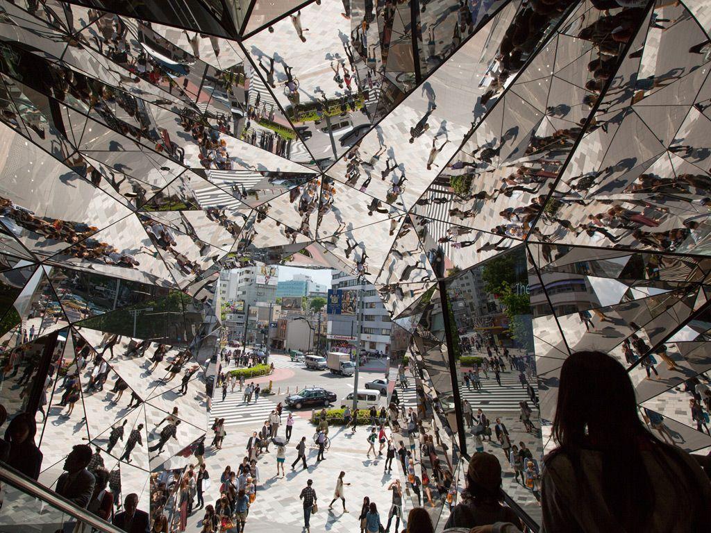 1024x768 Shoppers take the escalators under multifaceted mirrors at Tokyo