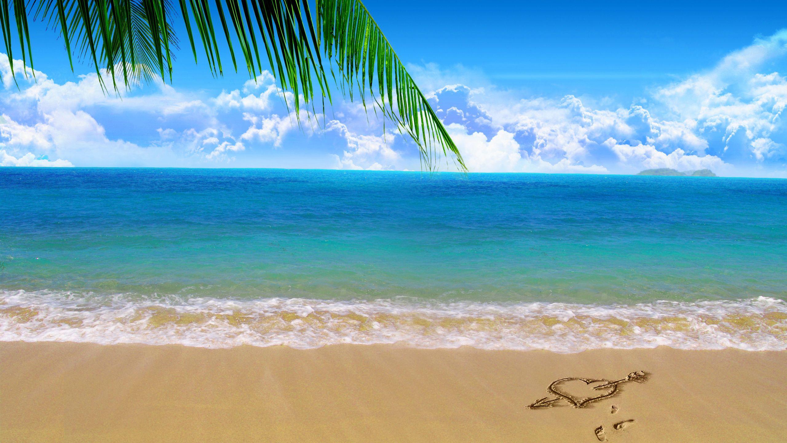 2560x1440 Love heart on beach sand