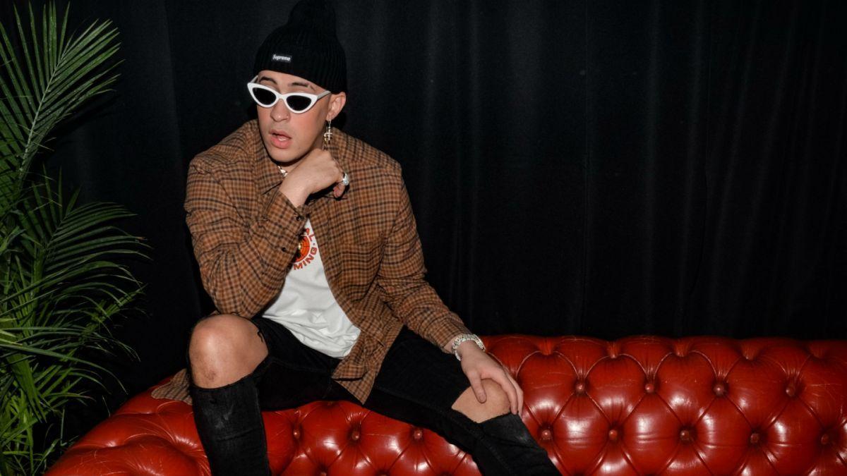 Bad Bunny Aesthetic Is Wearing Black Tshirt Standing In Blur Background  With Tongue Out HD Music Wallpapers  HD Wallpapers  ID 39070