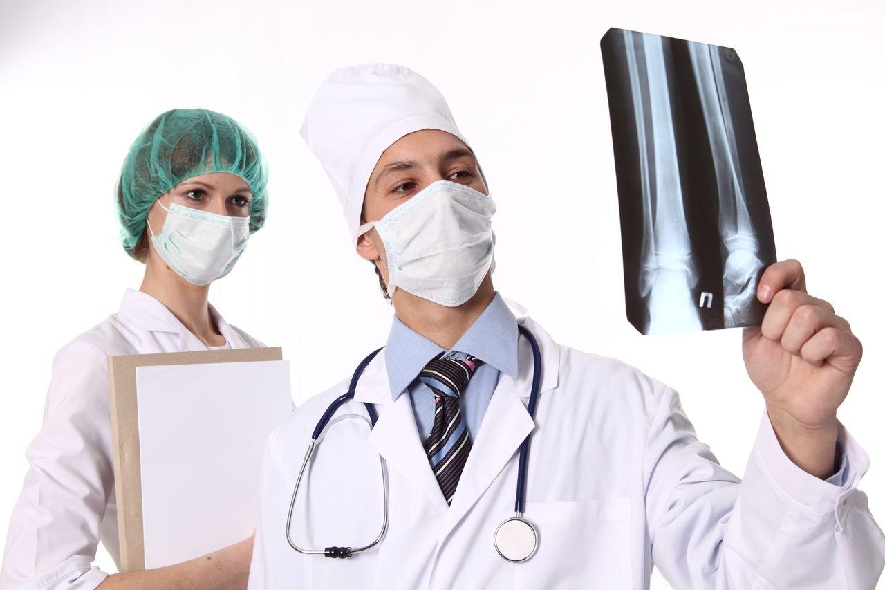Download Experienced Doctor Preparing Medical Equipment Wallpaper |  Wallpapers.com