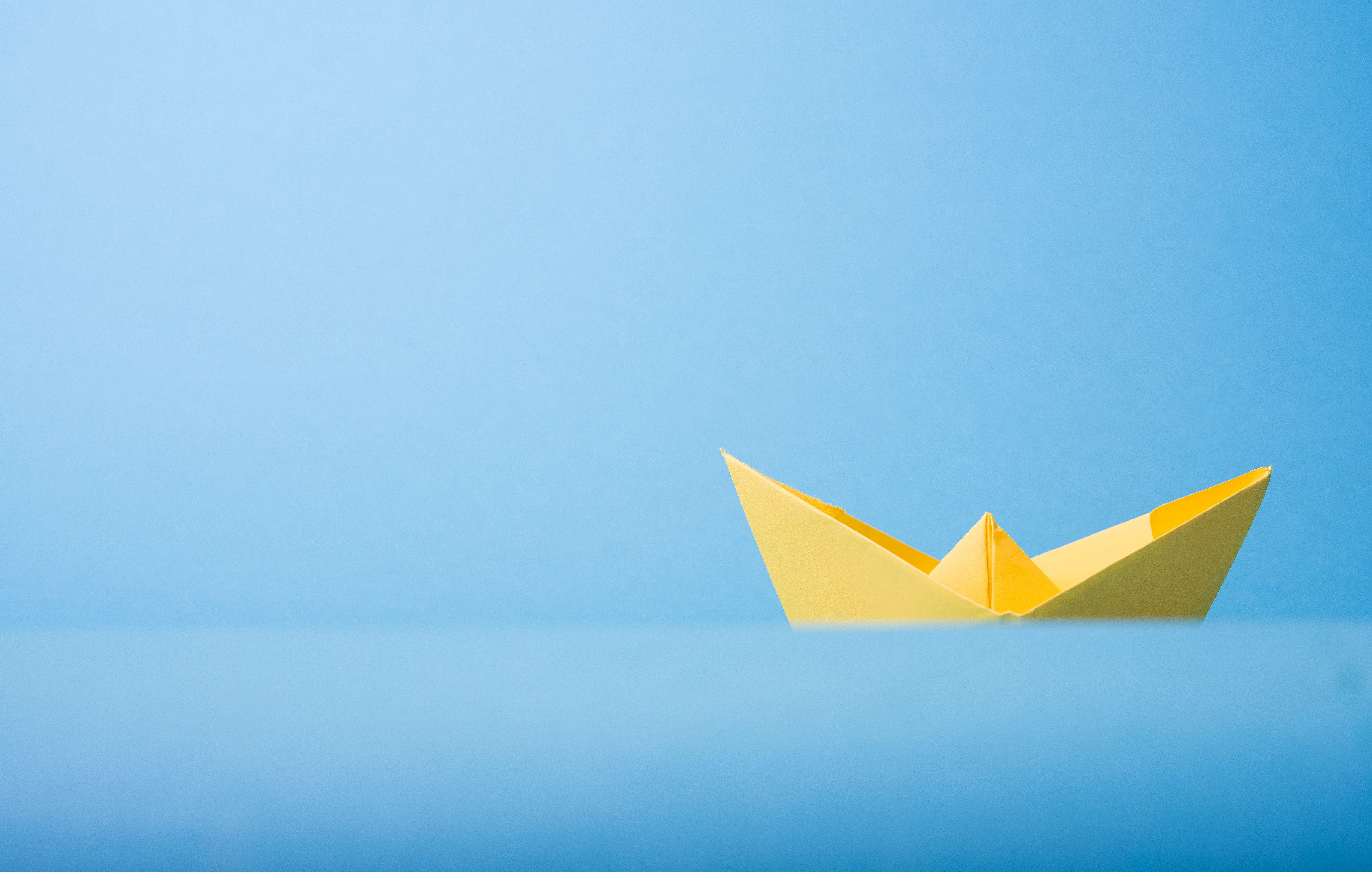 7340x4665 closeup photo of yellow paper boat photo