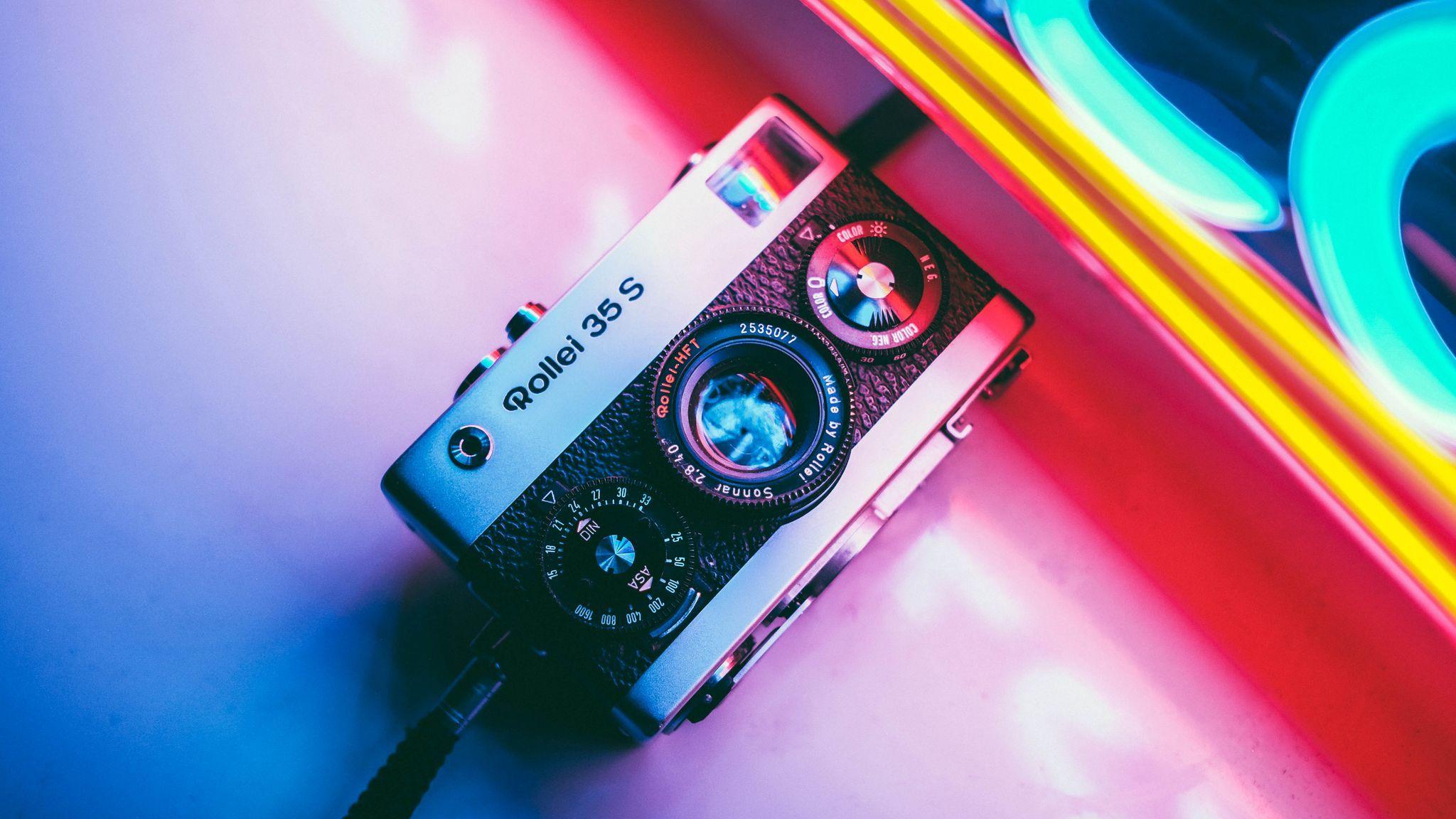 2048x1152 Download wallpaper 2048x1152 camera, neon, retro, light, colorful