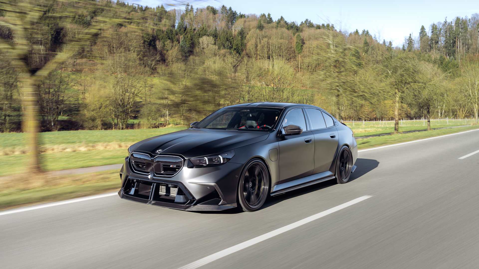 1920x1080 BMW M5 G90 coilover suspension & lowering. KW V4 coilovers
