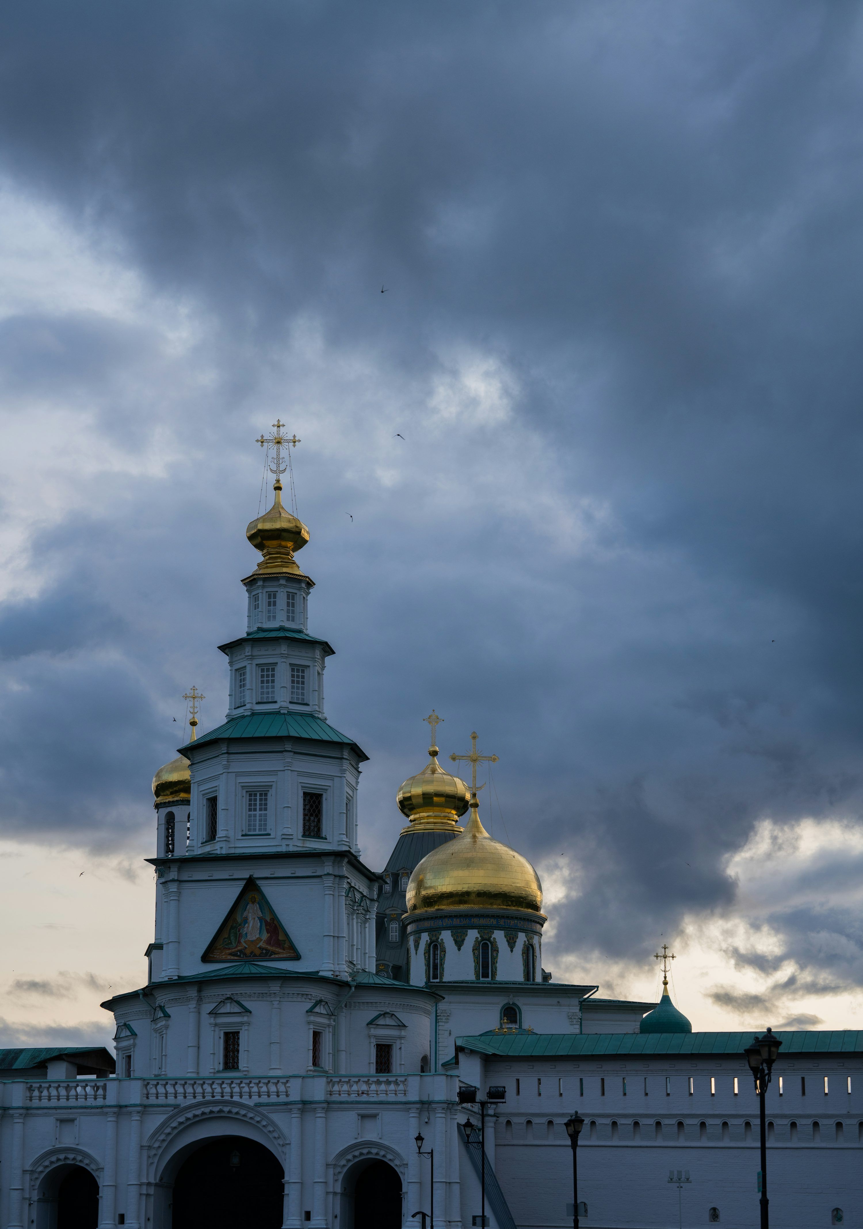 3000x4271 Blue Domed Church Towers Over A Historic Street With People. Photo
