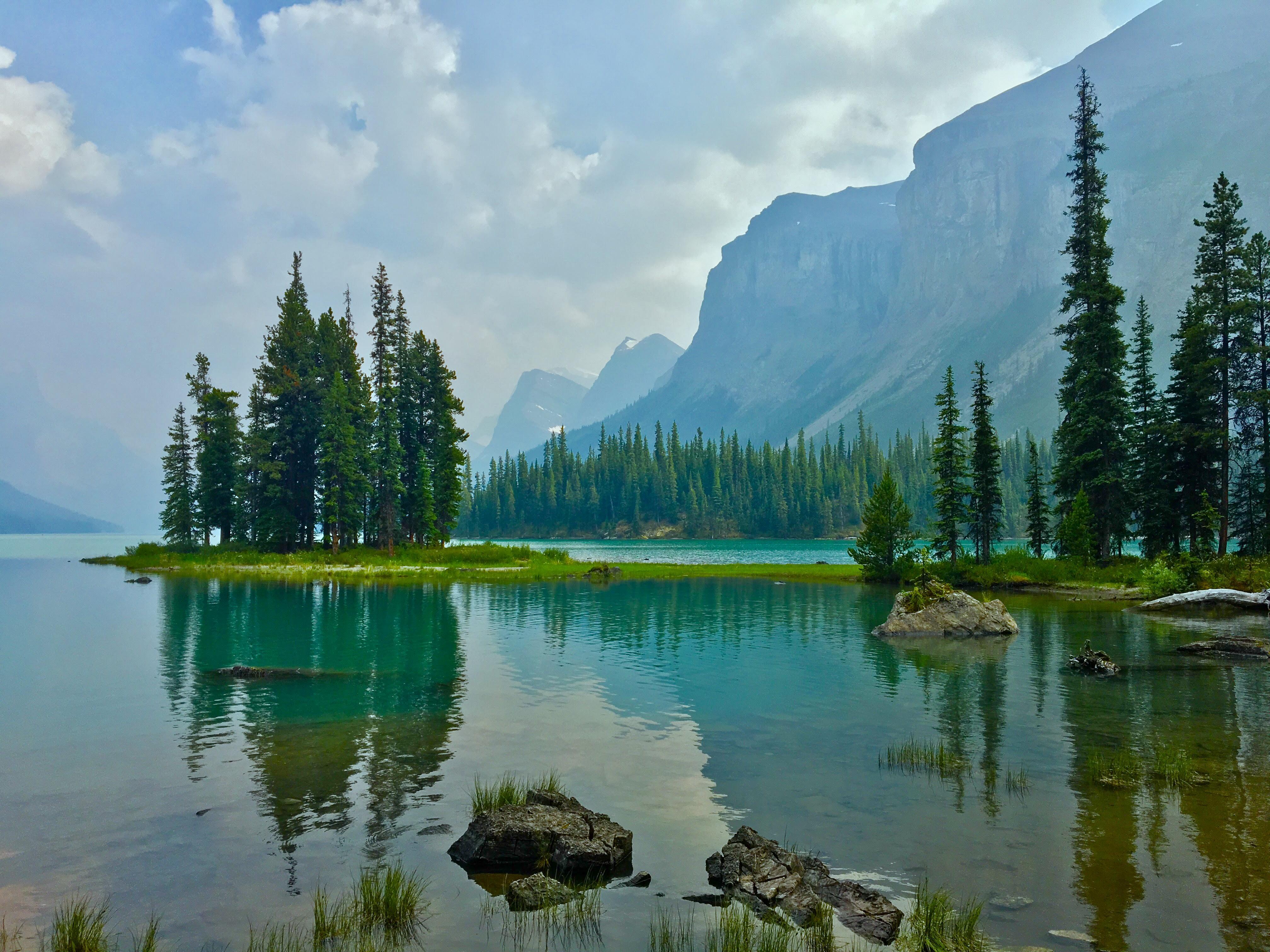 4032x3024 My favourite location on the planet. Spirit Island in Banff National Park in Canada. The haze in the photo is from the Fort McMurray wildfires. [4032x3024] [OC]