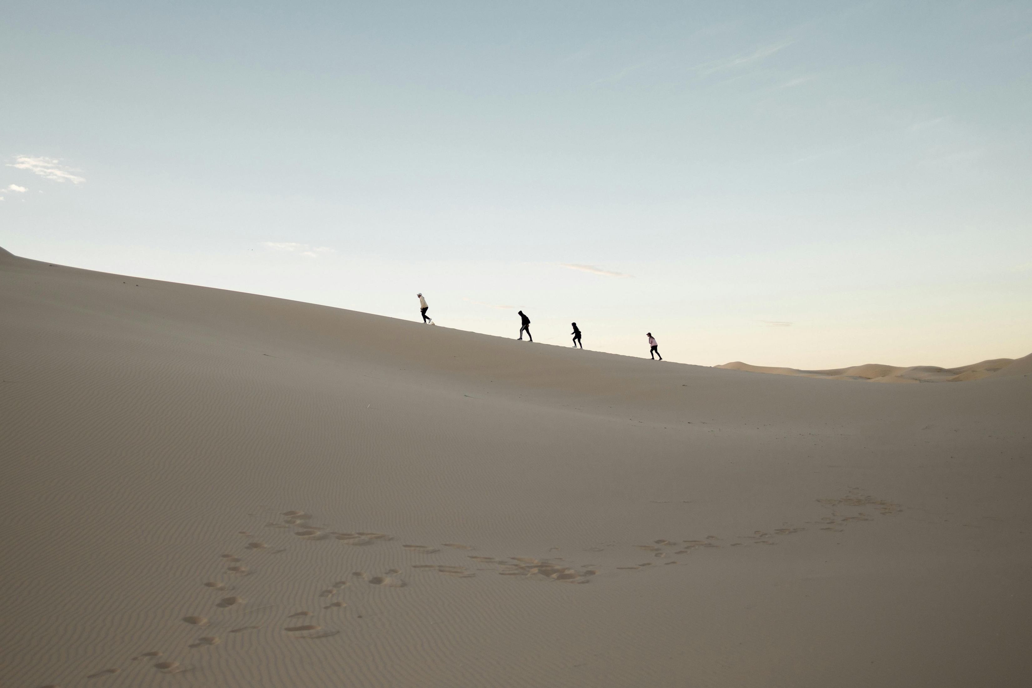 3300x2200 Four Men On A Sand Dune In The Desert