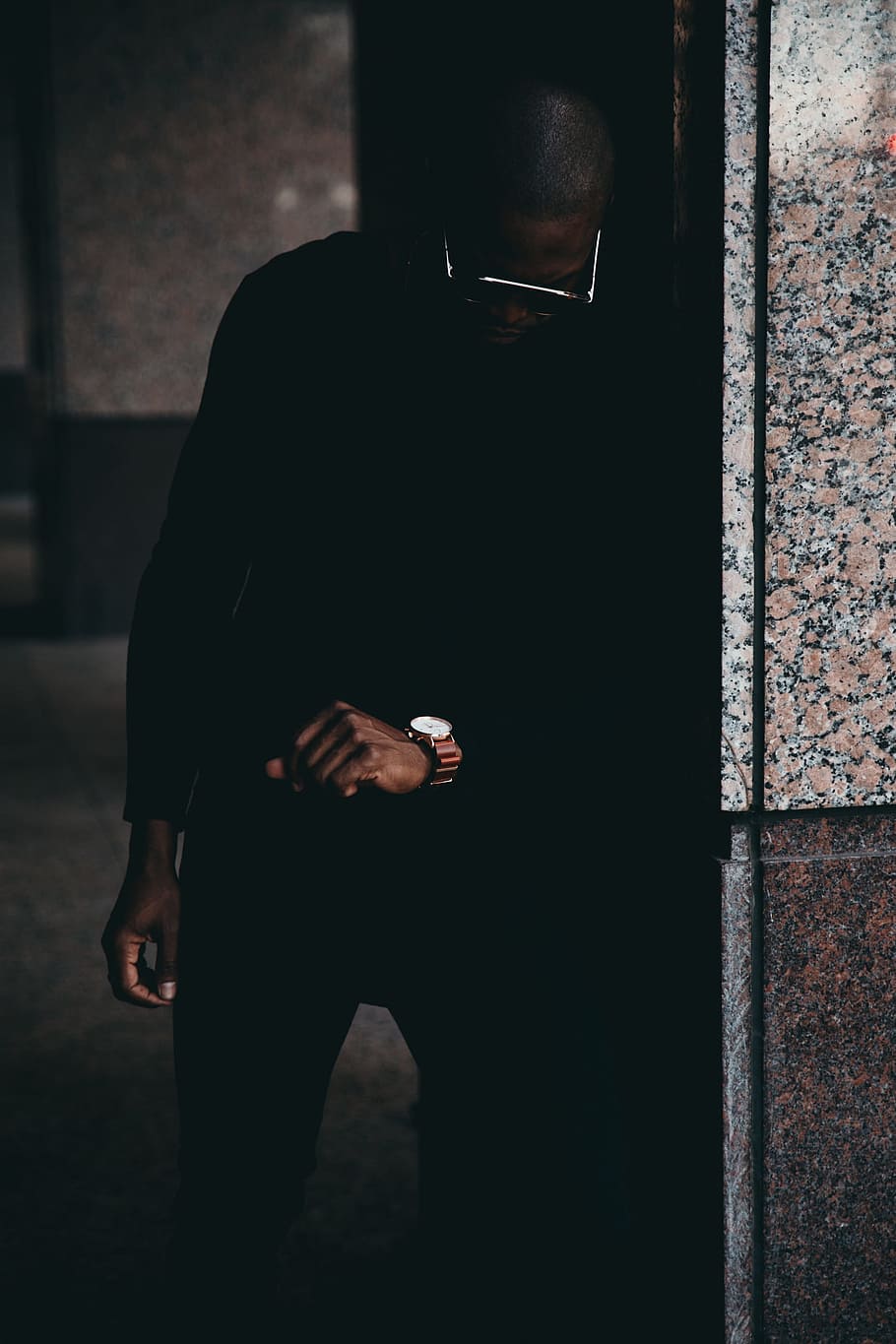 910x1365 man, leaning, wall, staring, watch, male, dark, shadow