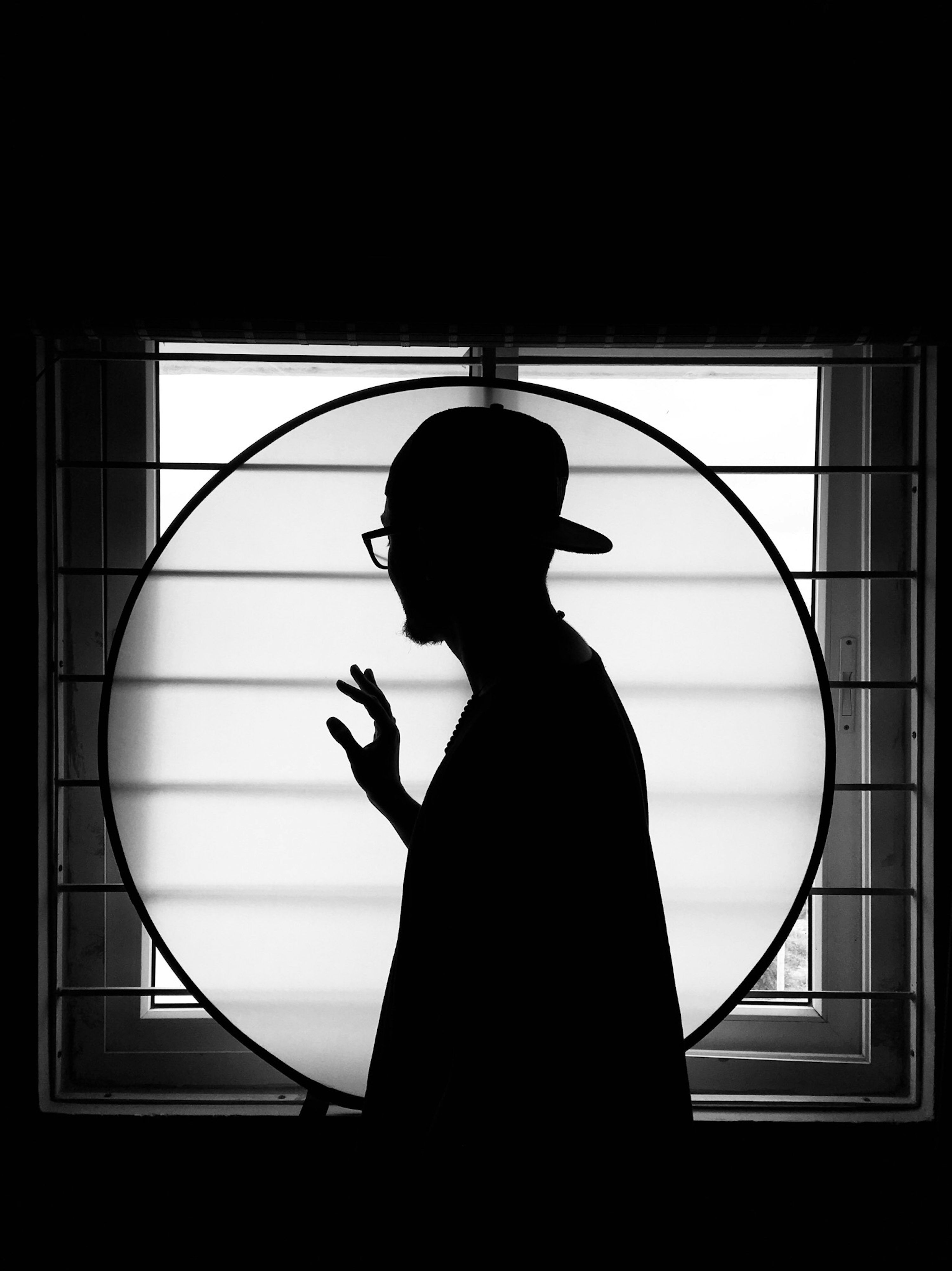 3000x4003 Silhouette of man standing on window photo