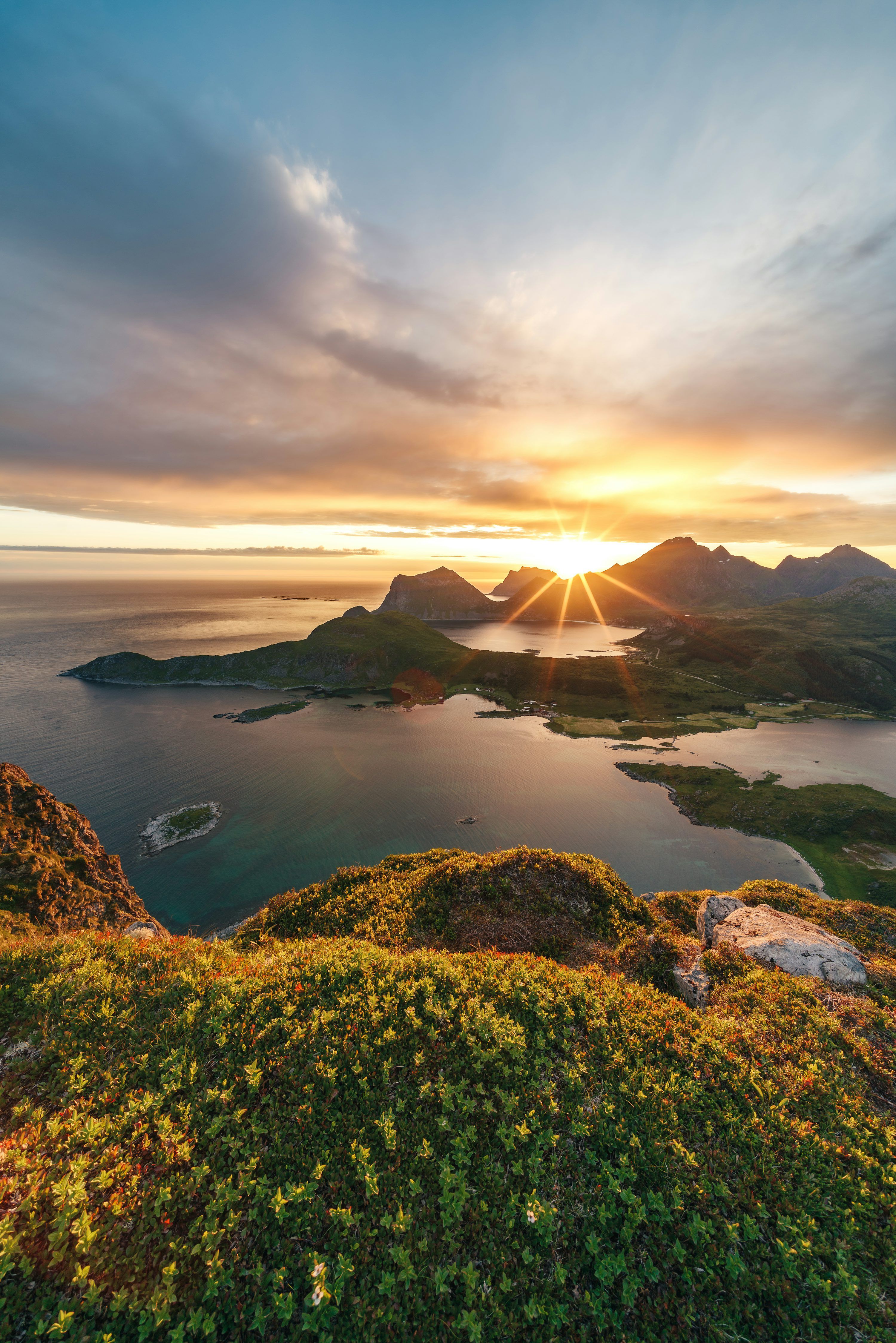 3000x4498 The sun is setting over an island in the ocean photo