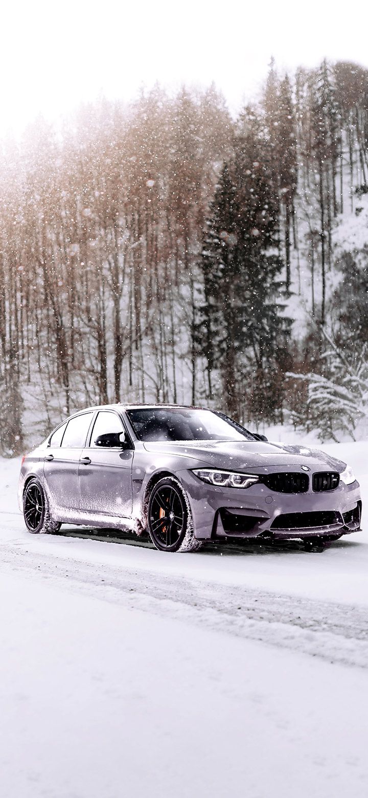 720x1560 Gray BMW on snowy road 4K phone Wallpaper