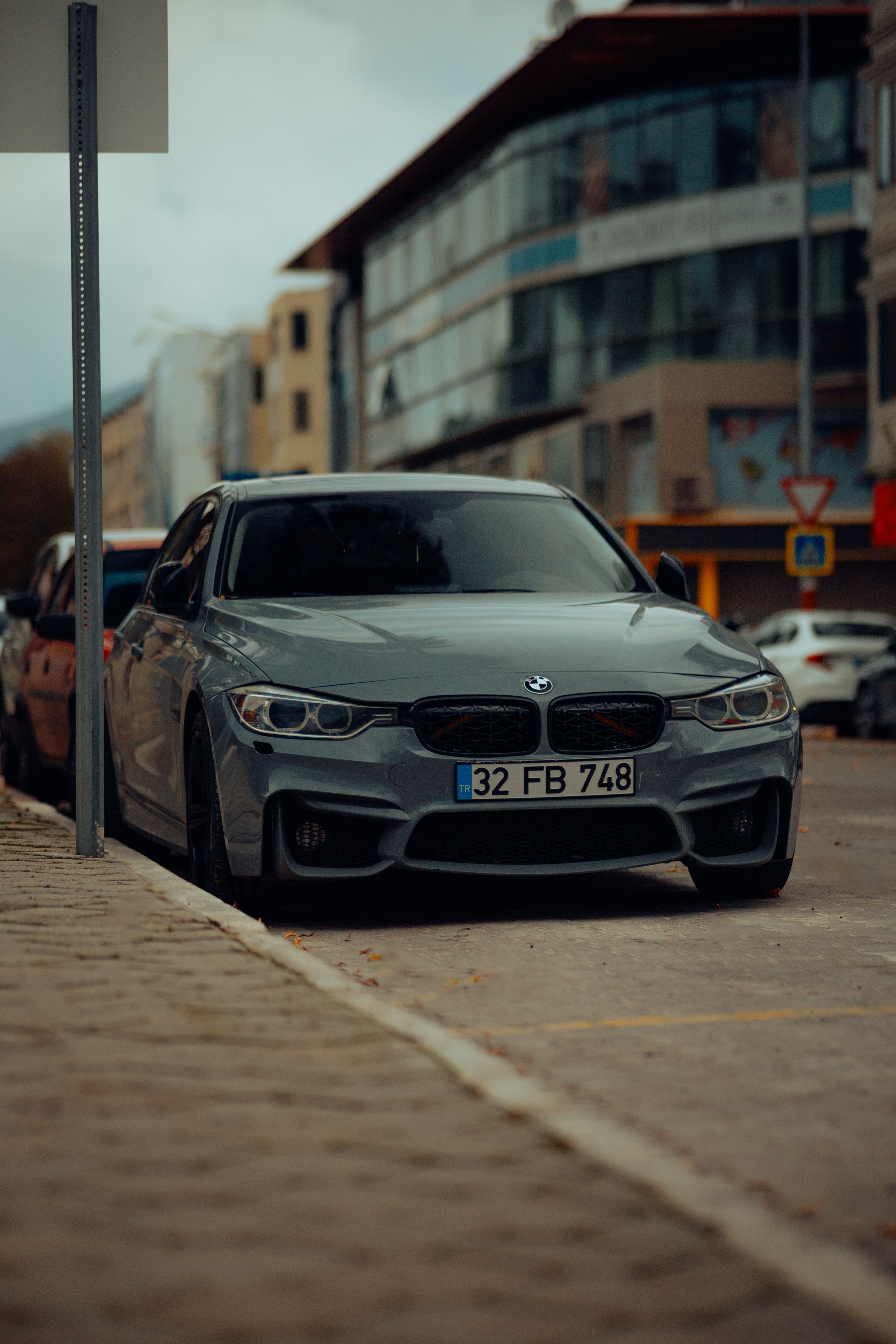 3834x5751 A Gray BMW M3 Parked on the Side of a Street in City · Free