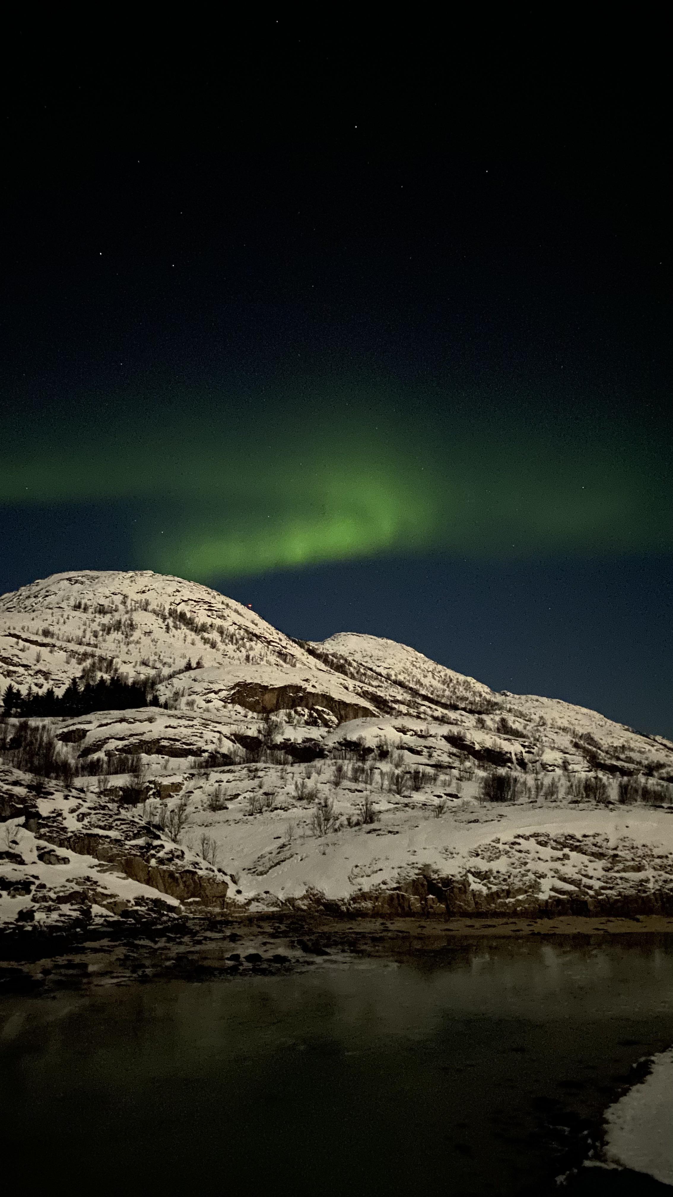 2268x4032 Finally got to see aurora near Tromsø for the first time. One of the most beautiful thing I've seen