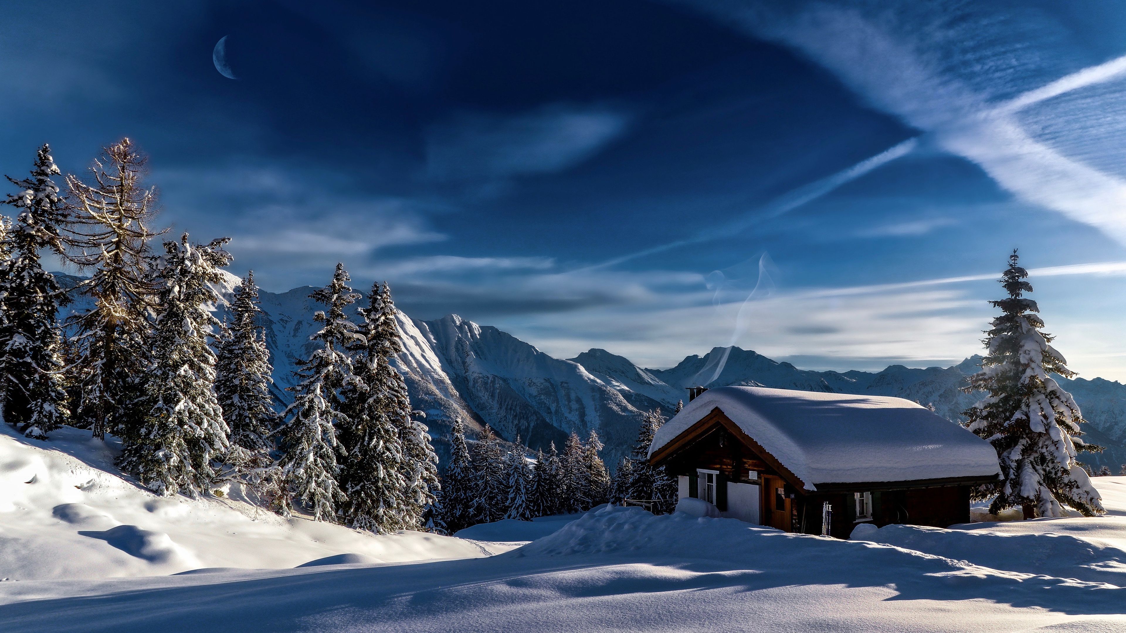 3840x2160 Snow Covered House Trees Mountains Background Under Blue Sky 4K HD Winter Wallpaper