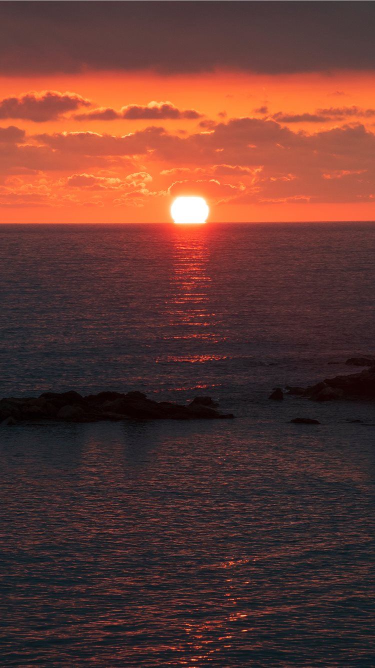 750x1334 sunset under nimbus clouds iPhone 8 Wallpaper Free Download