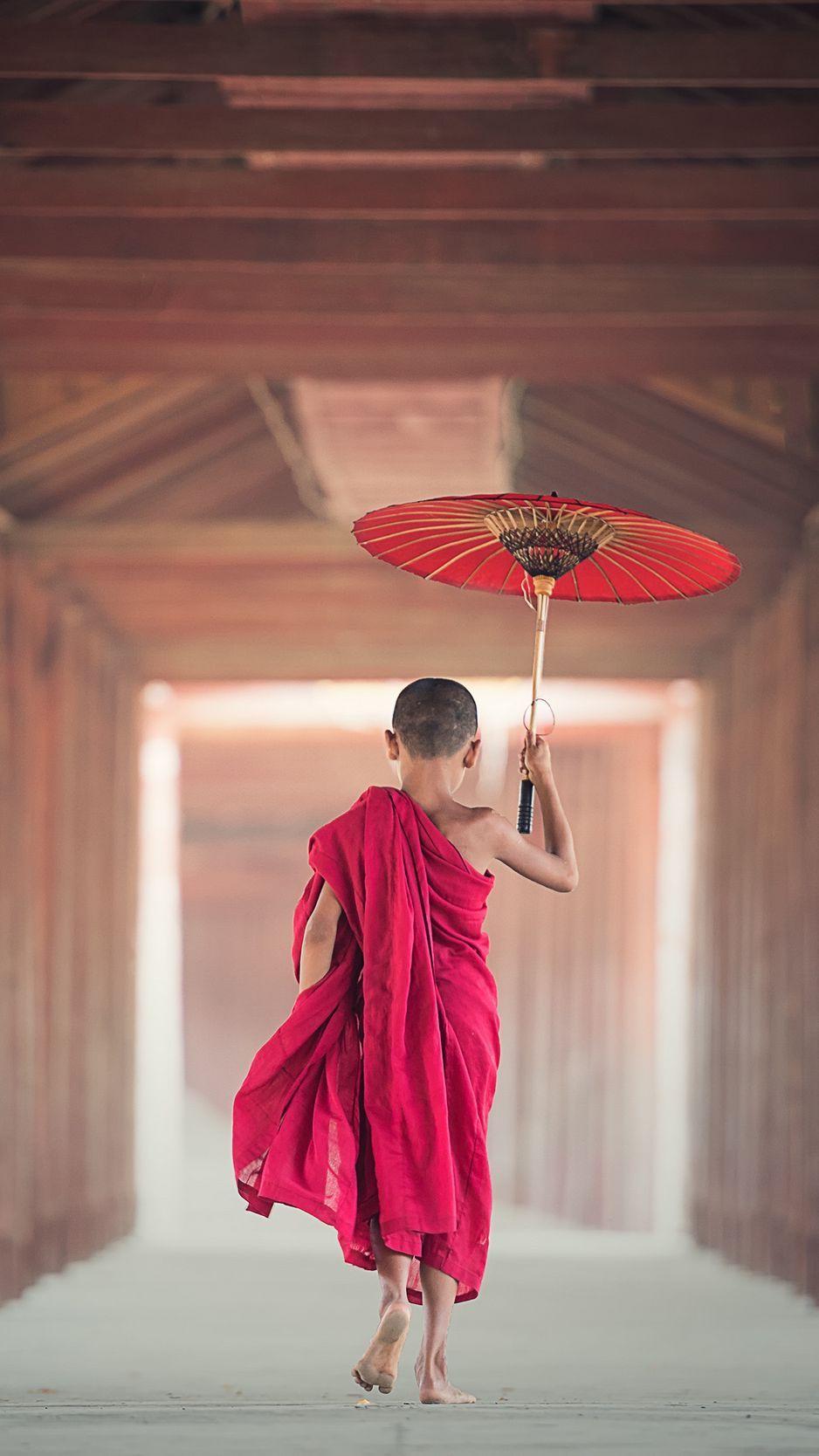 938x1668 Download wallpaper 938x1668 boy, monk, child, umbrella, buddhism