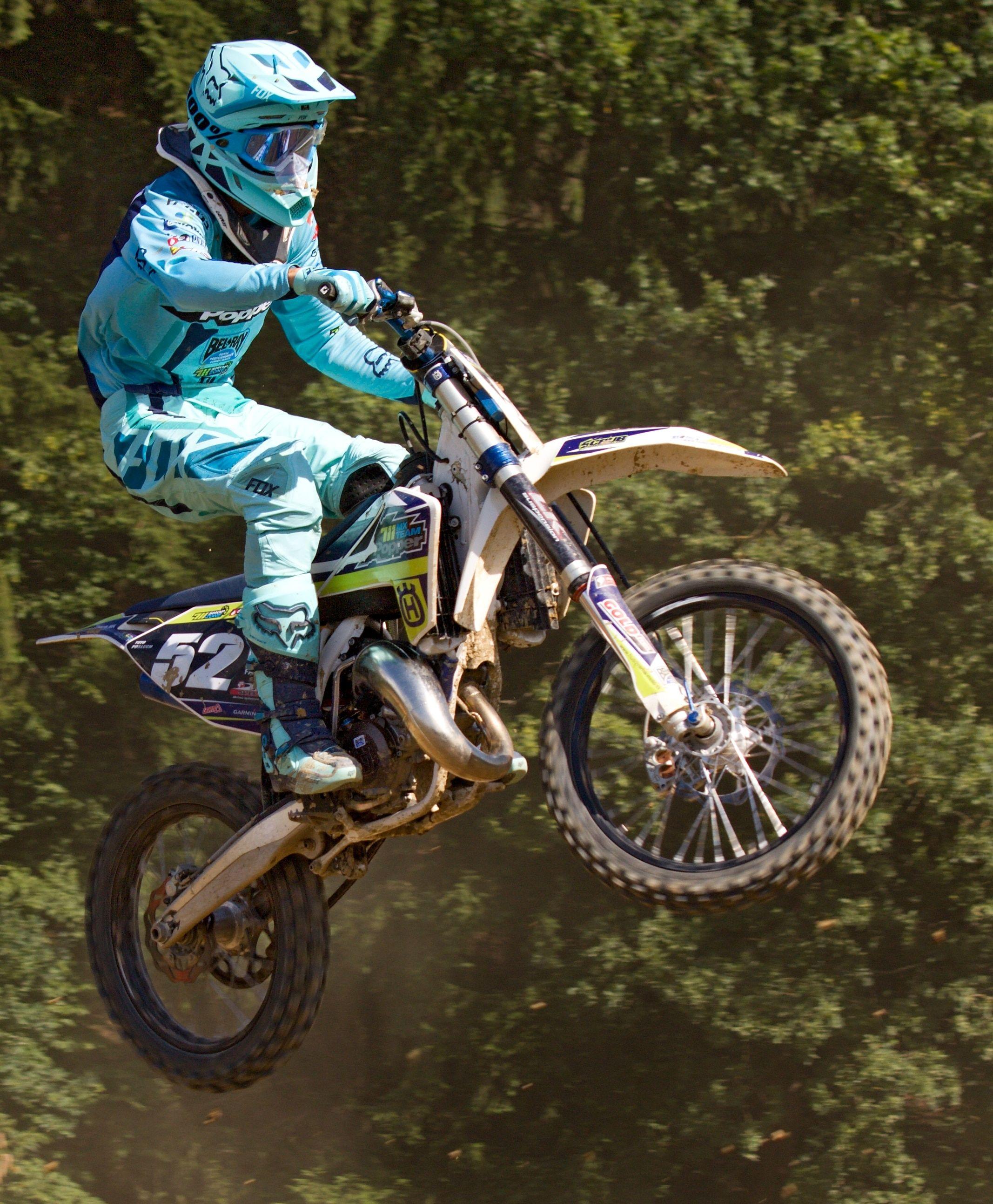 2134x2585 person riding black and white motocross dirt bike free image