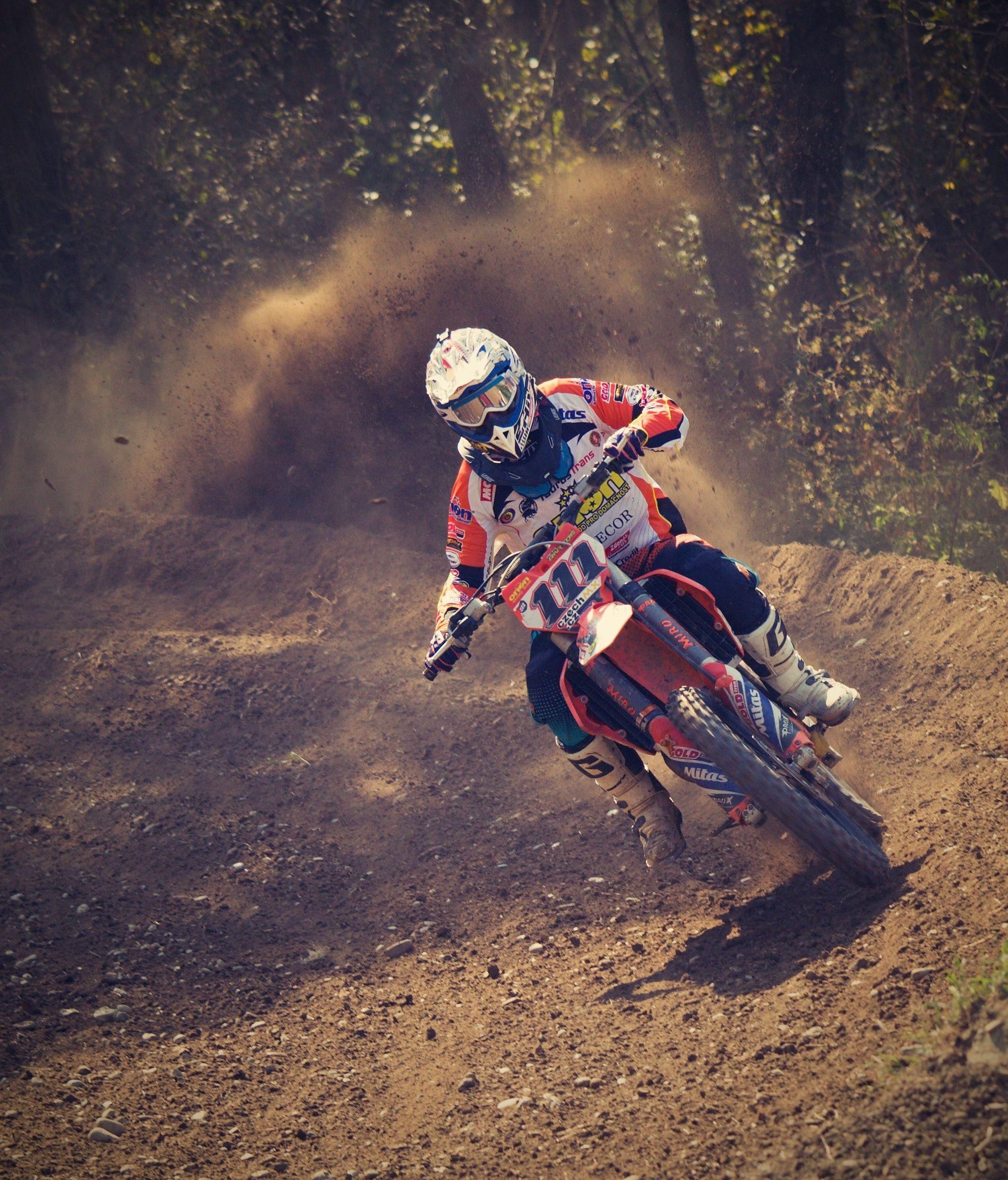 1986x2325 Man in White and Orange Motocross Overall Riding His Motocross