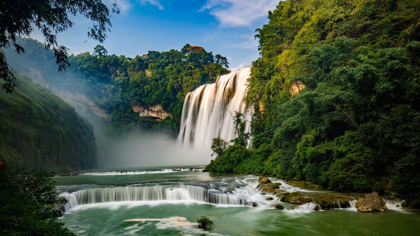 1366x768 Download wallpaper 1366x768 waterfall, river, precipice, trees