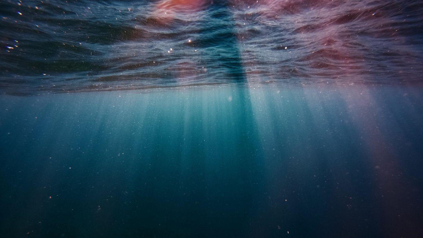 1366x768 Download 1366x768 wallpaper underwater, sunrays, blue water, sea