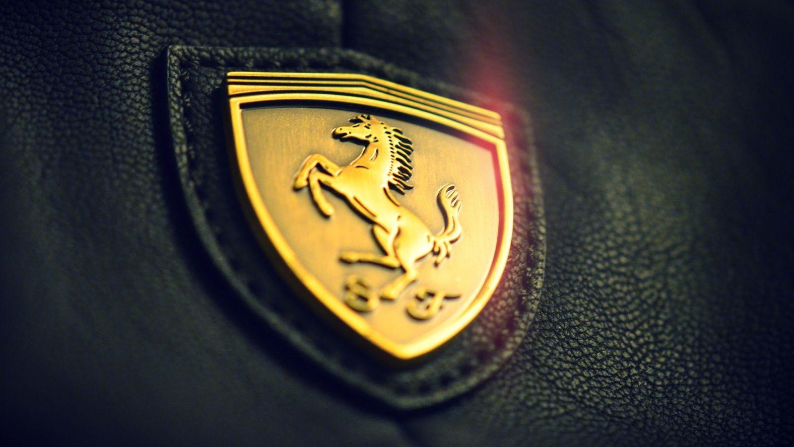Hình nền biểu tượng xe hơi Ferrari 1600x900 vàng Full HD.  Logo Ferrari