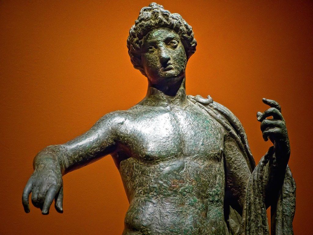 1024x768 Closeup of Apollo with elaborate hairstyle in a strong con