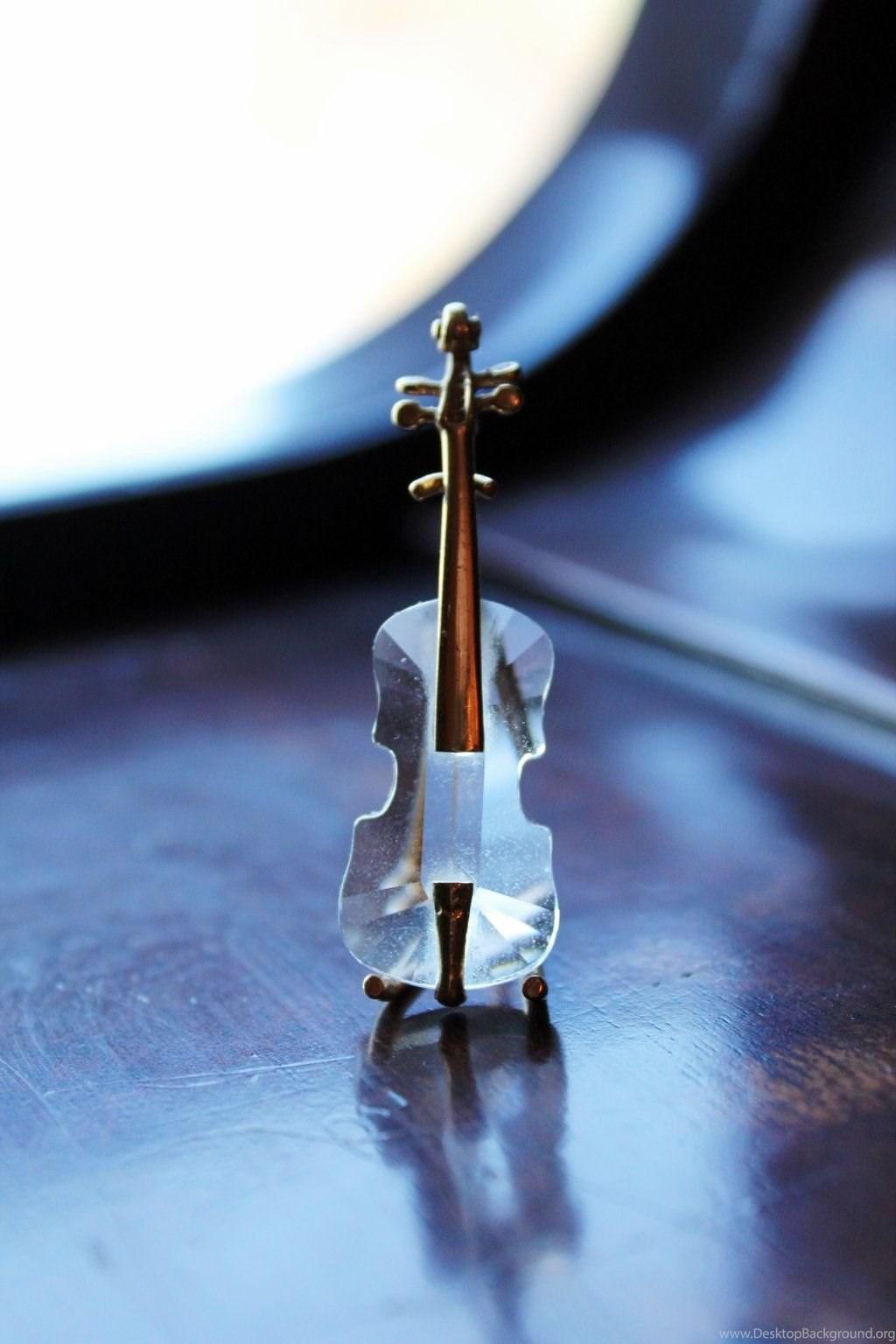 Violin on a dark background. An old violin lies on a table against a dark  background. | CanStock