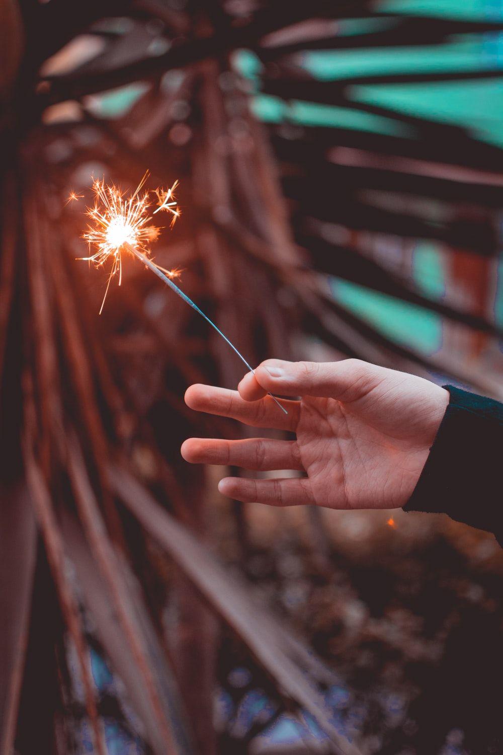 1000x1500 person holding sparklers photo