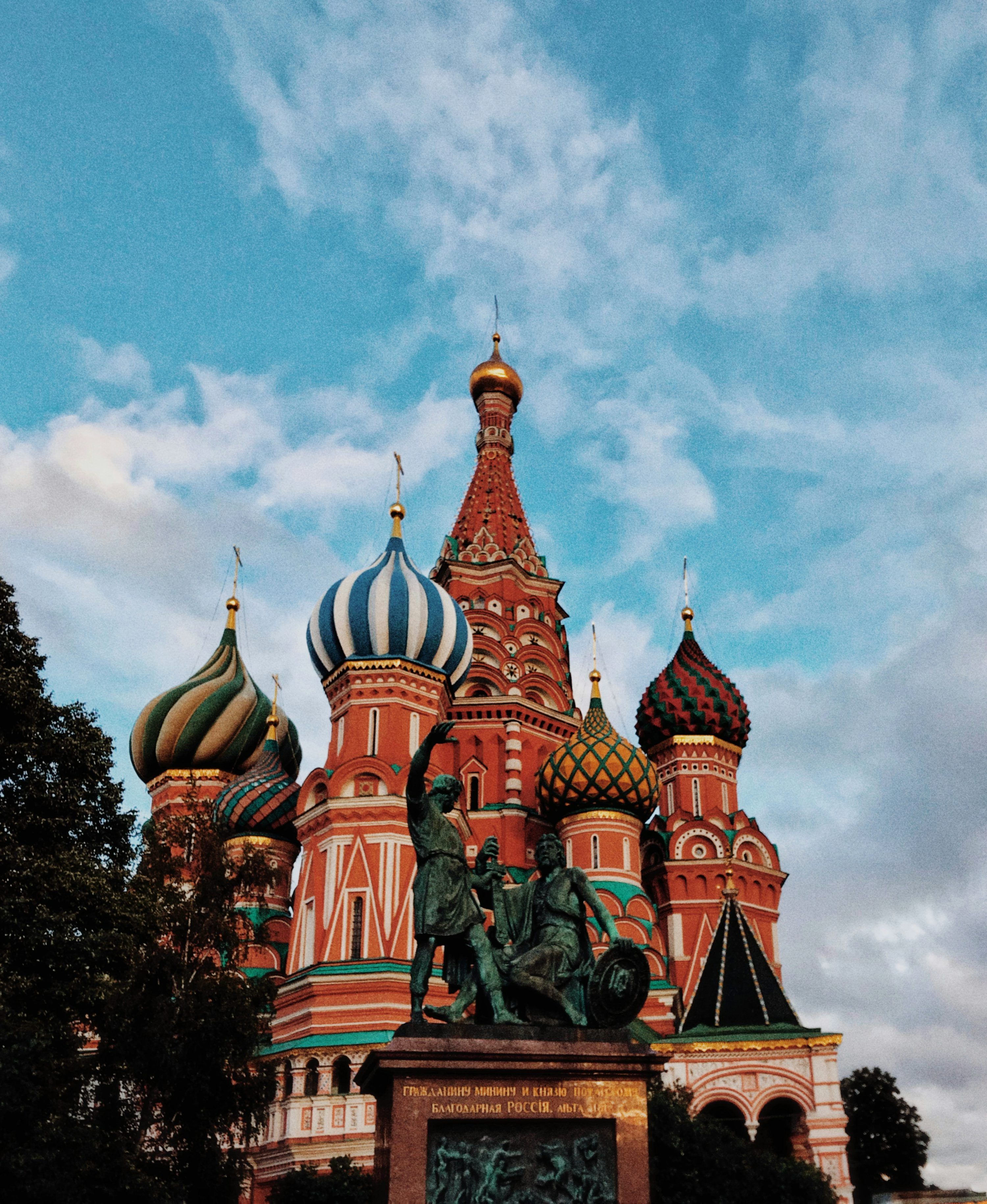 3000x3660 A large building with colorful domes with Saint Basil's Cathedral in the background photo