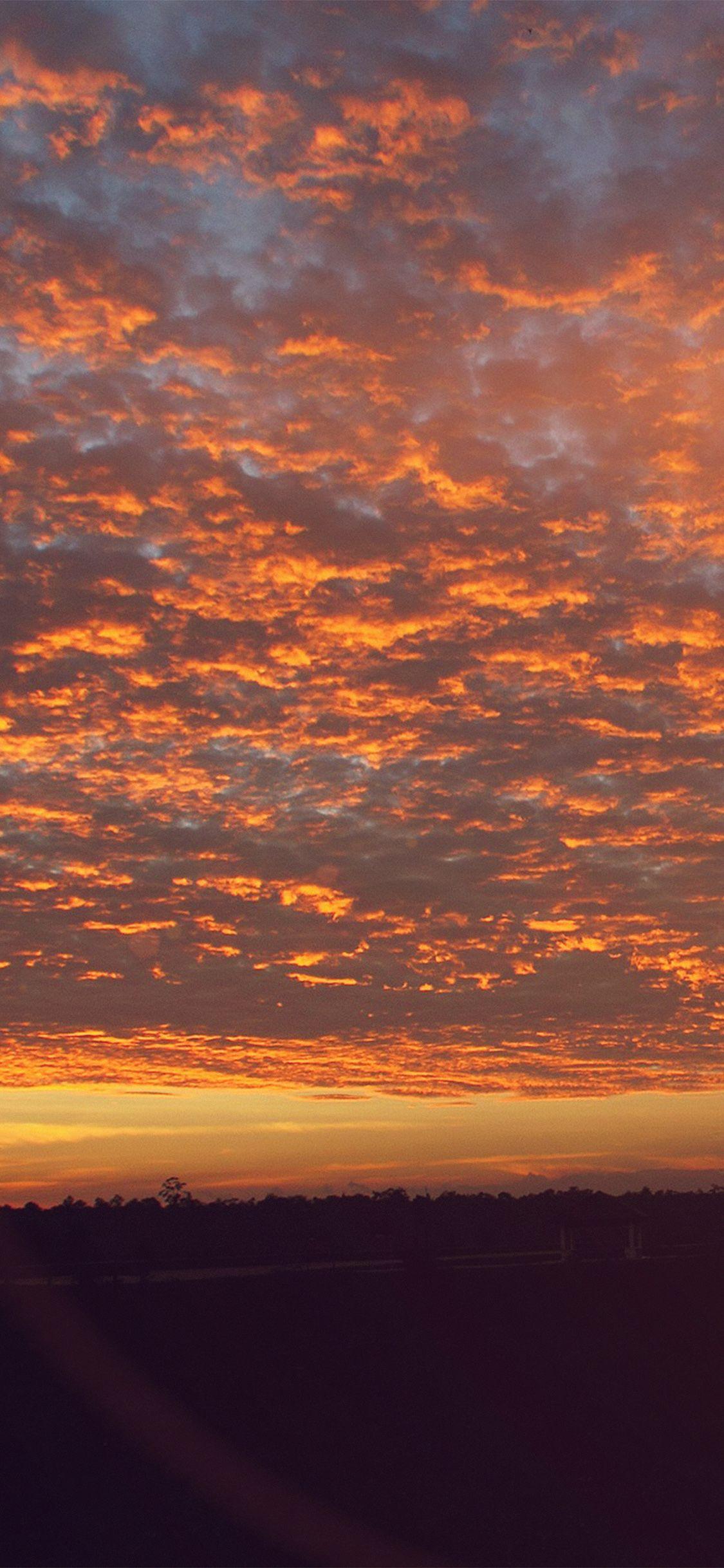1125x2436 Sunset Sky Cloud Vacation Nature Red Flare Wallpaper